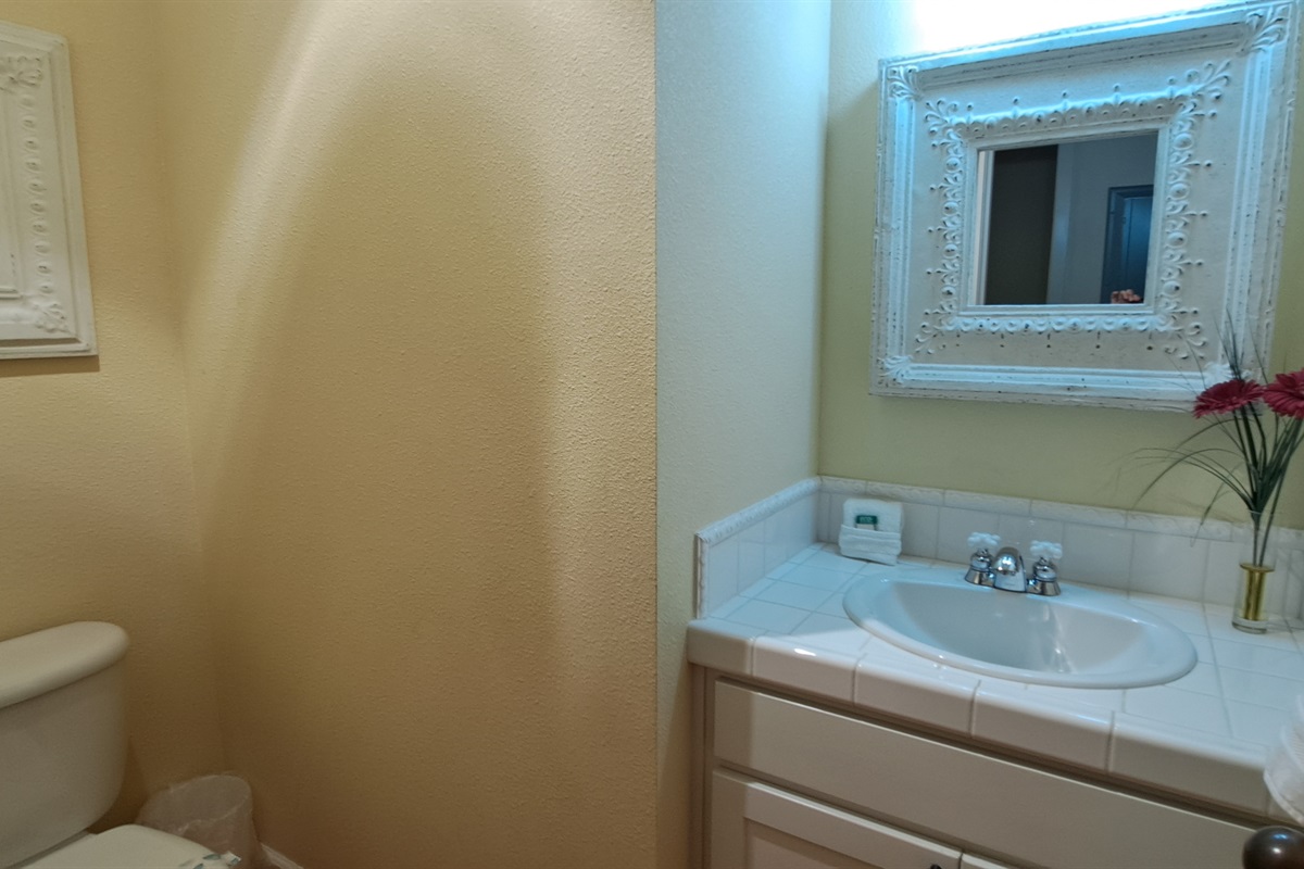 Convenient half bath located just off the main living area.