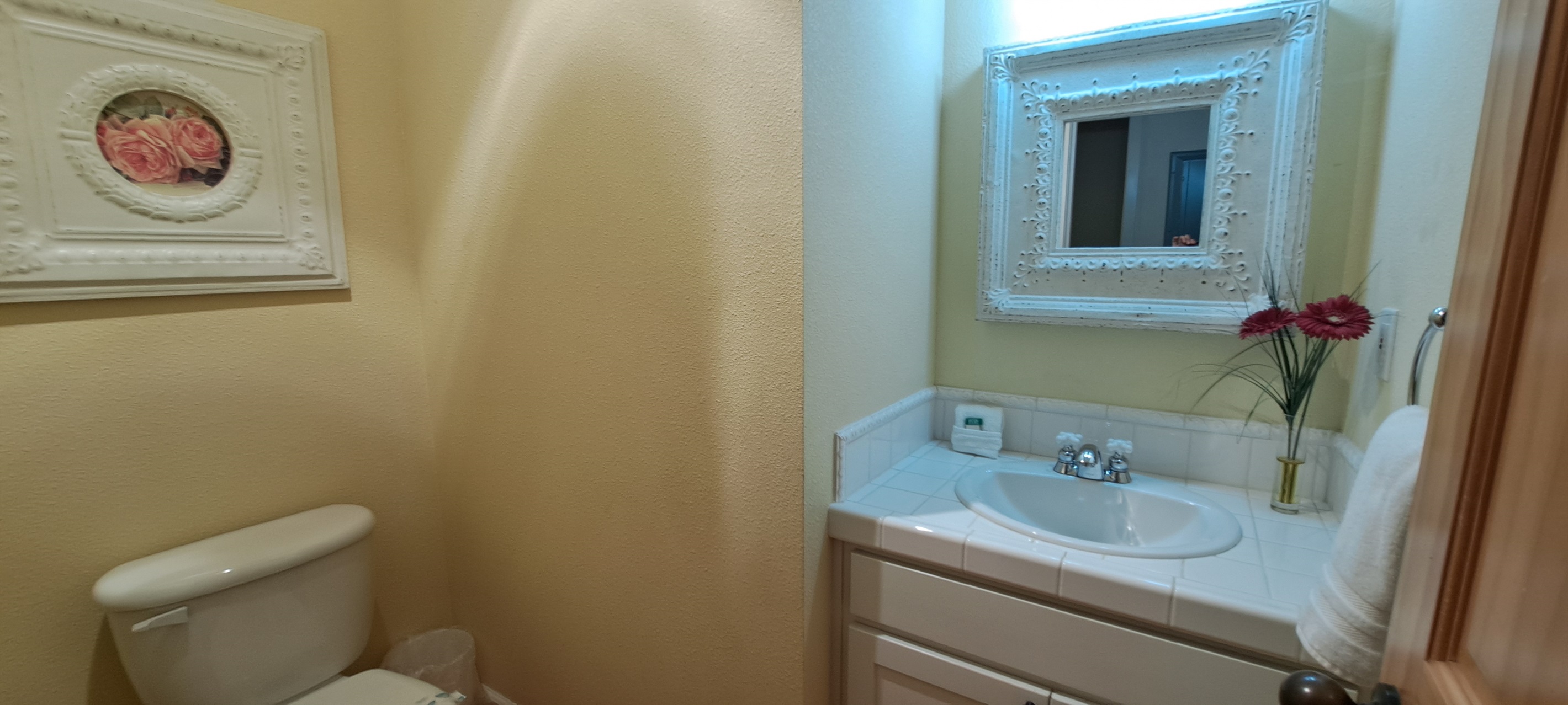 Convenient half bath located just off the main living area.