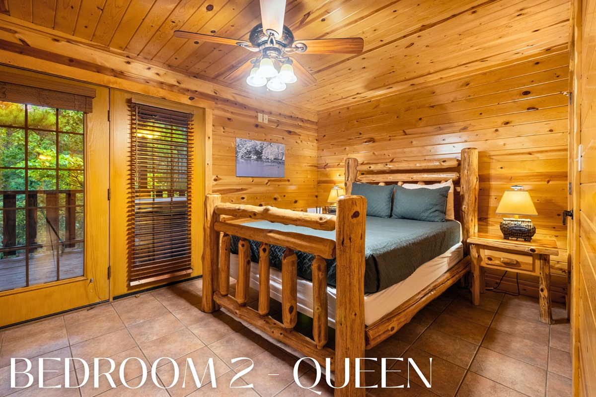 Bedroom with log bed and private deck access.