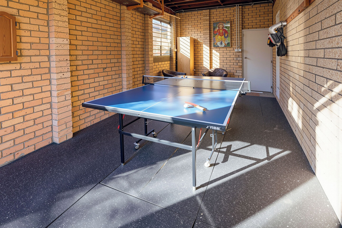 Table tennis, warm brick walls and afternoon light give Luna’s Sanctuary an extra indoor hangout space beyond the main living areas.