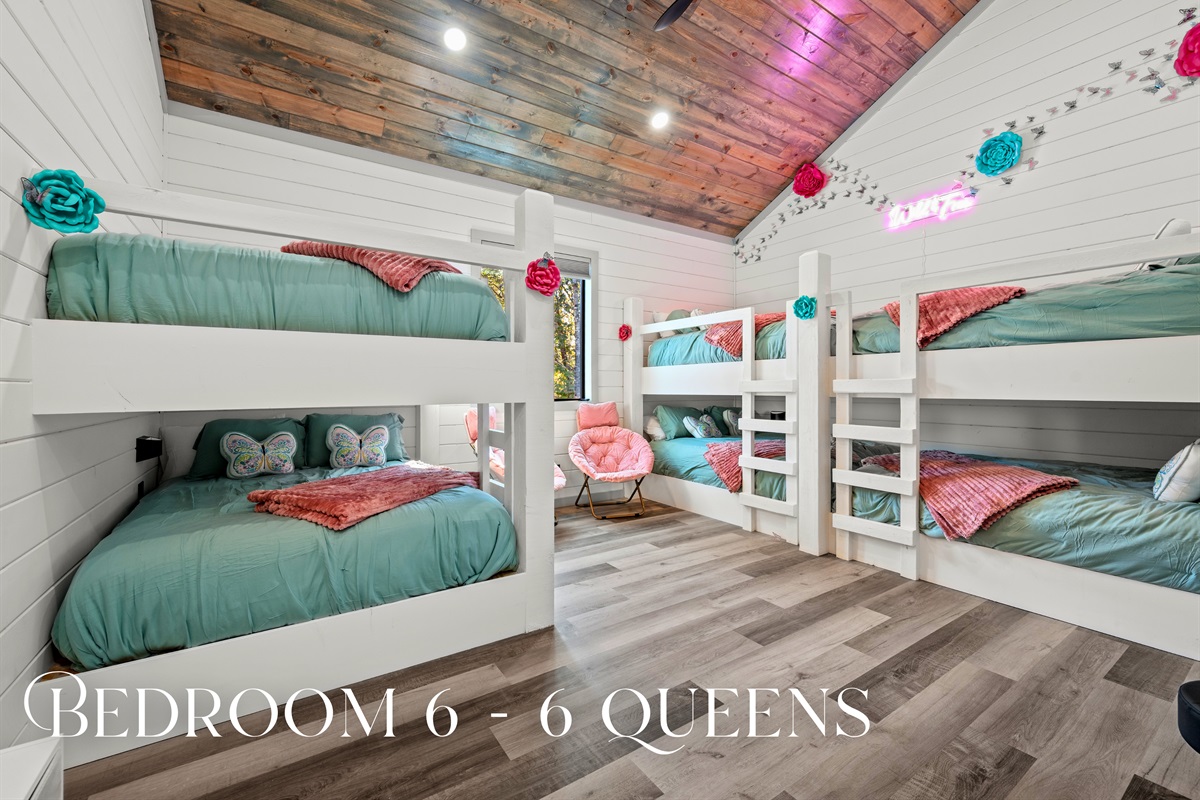 The bright bunkroom bursts with color and personality, giving everyone plenty of space to sleep, laugh, and play.