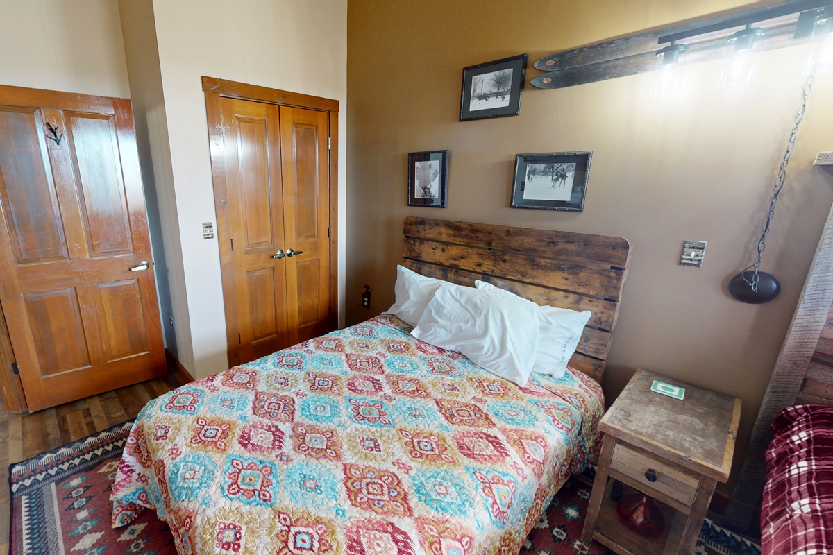 Wake up to sunlight over the mountain from this charming ski lodge-style bedroom.