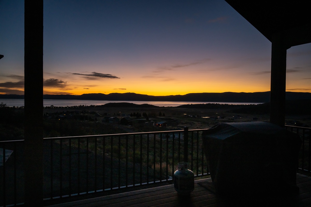 Private deck showcasing breathtaking sunset views over Bear Lake—an unforgettable backdrop for evening gatherings.