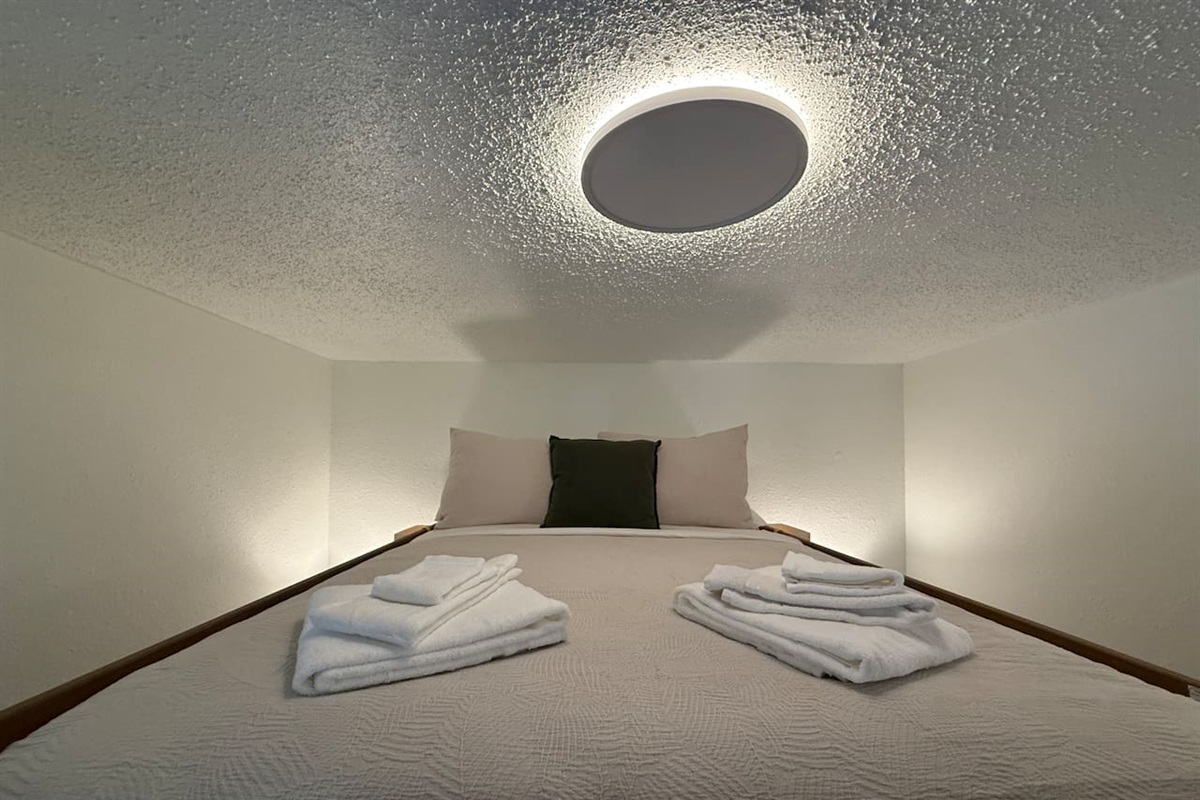 The top bunk offers a snug and cozy sleeping experience, perfect for winding down after a day of mountain adventures.