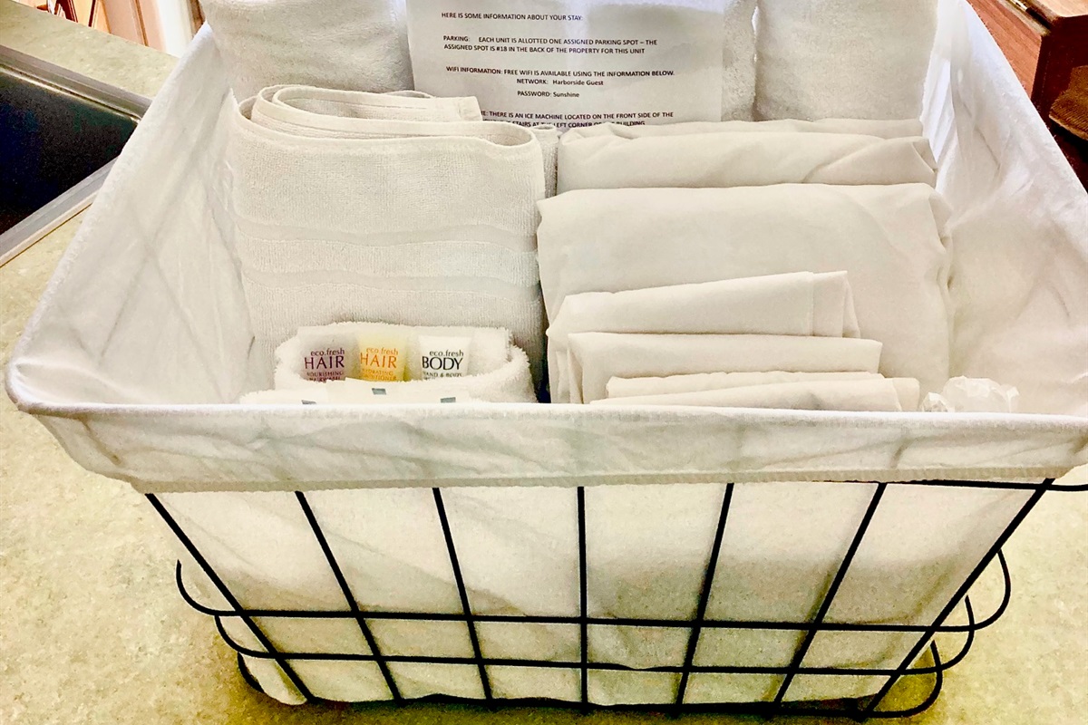 Welcome basket complete with linens, towels, and complimentary soaps and shampoo