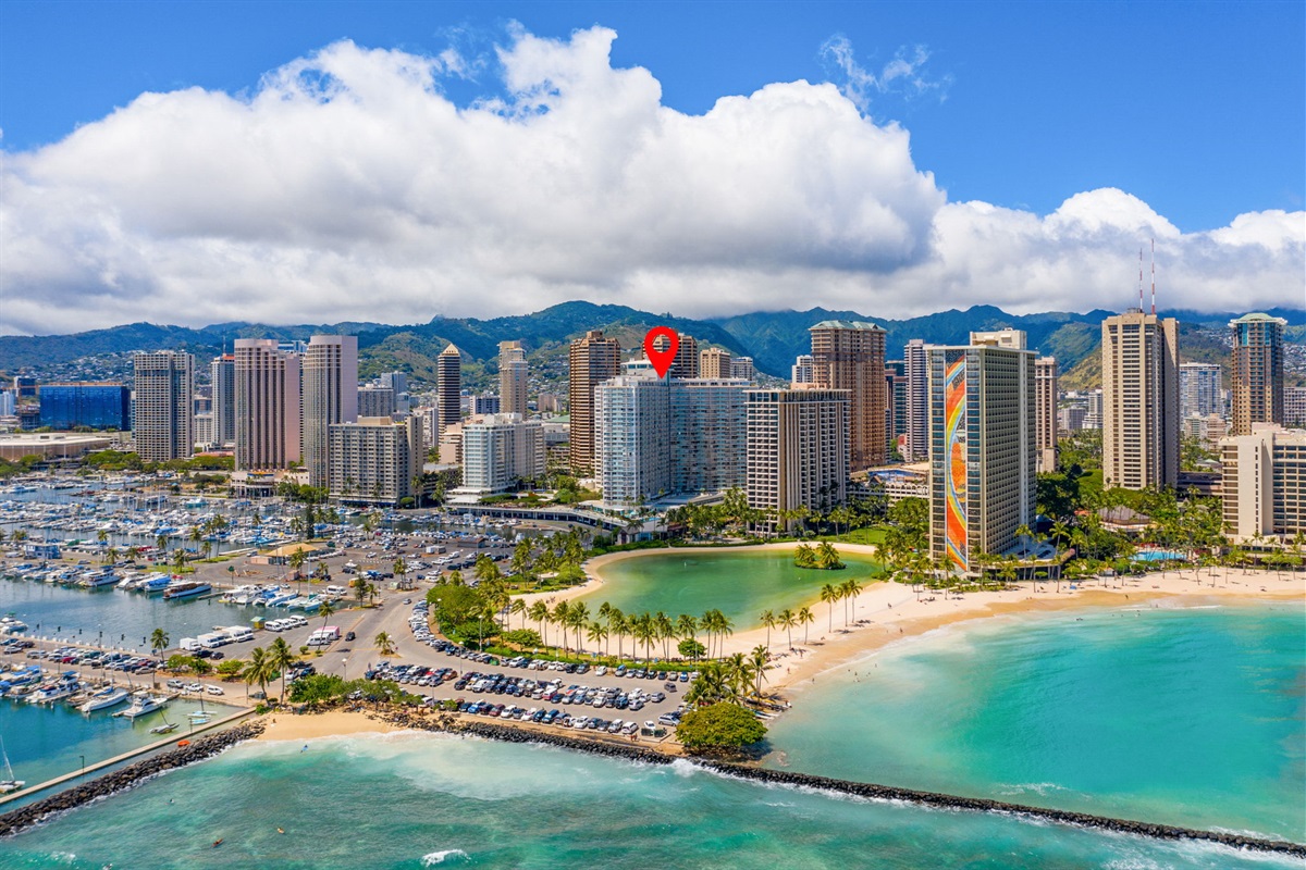 Aerial view of the Ilikai Hotel located steps away from the beach and Duke's Lagoon, Ala Wai small boat harbor and Waikiki beach 