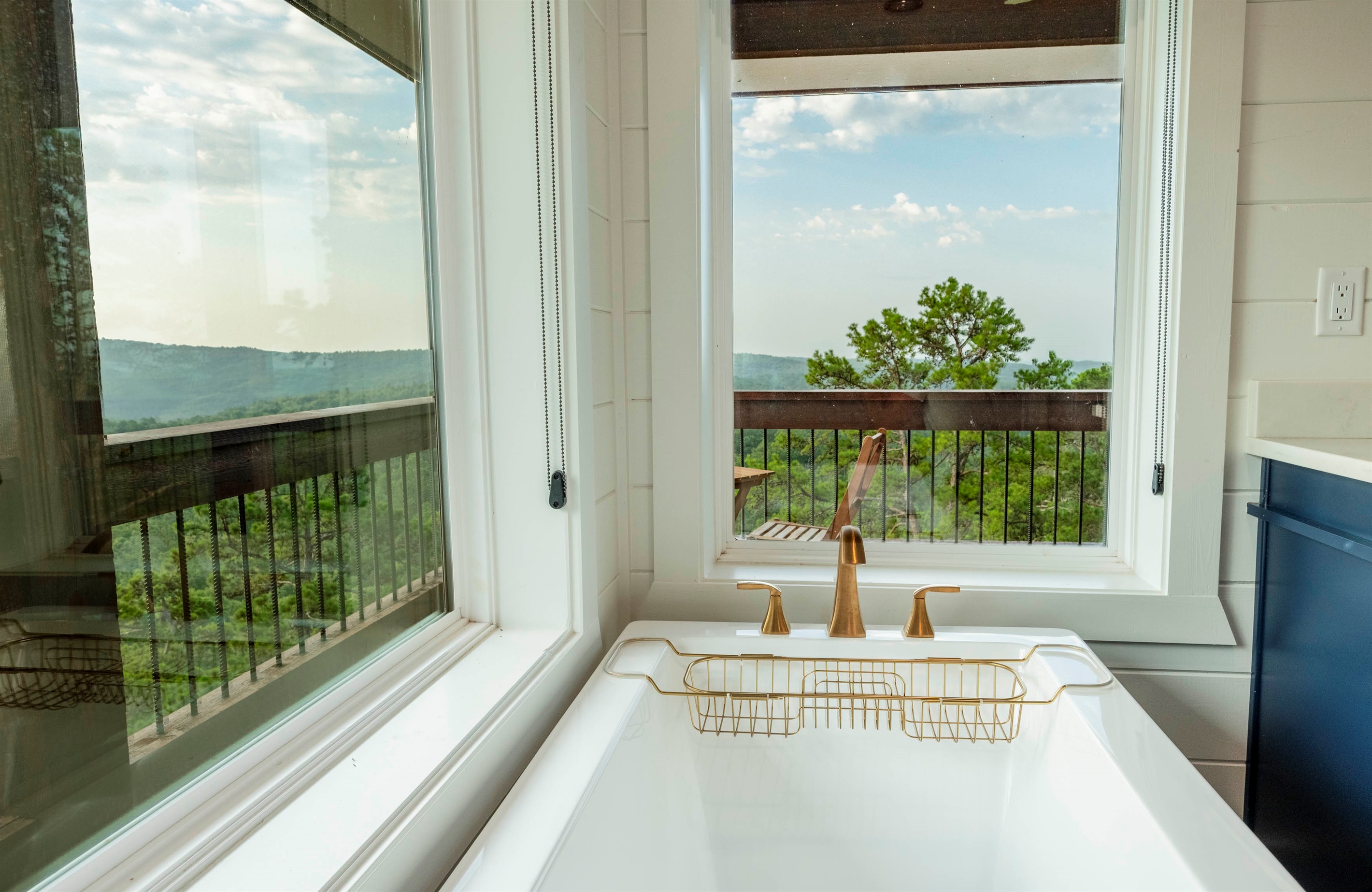 Spa-style soaking tub with peaceful nature views for the perfect unwind