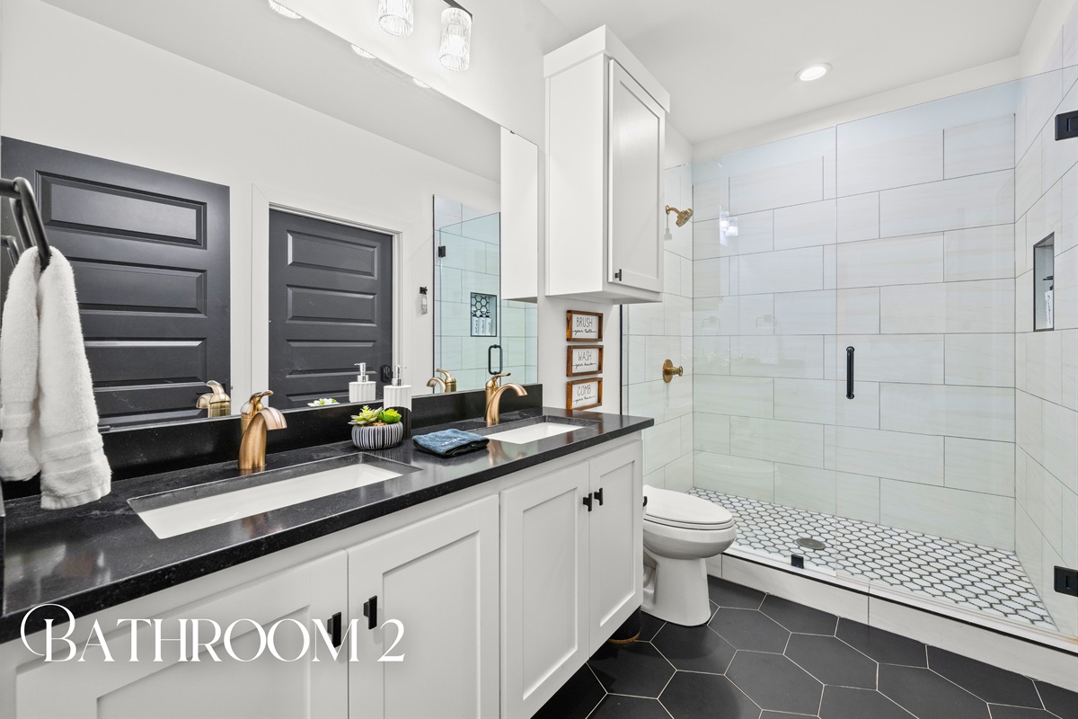 Bathroom two is bright and thoughtfully designed, with clean lines and plenty of space to get ready comfortably.