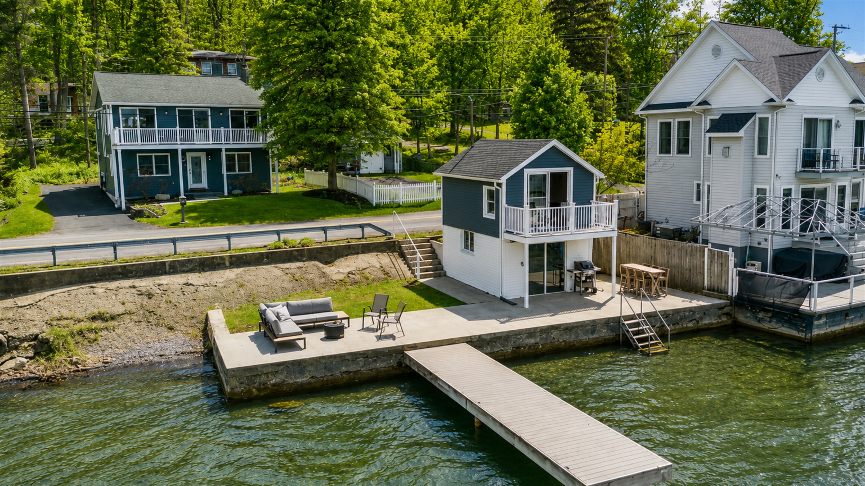 This charming lakeside cottage offers an unbeatable waterfront setting with a spacious patio, cozy fire pit, and your own dock—ideal for relaxing or entertaining. 🏡🔥🌊
