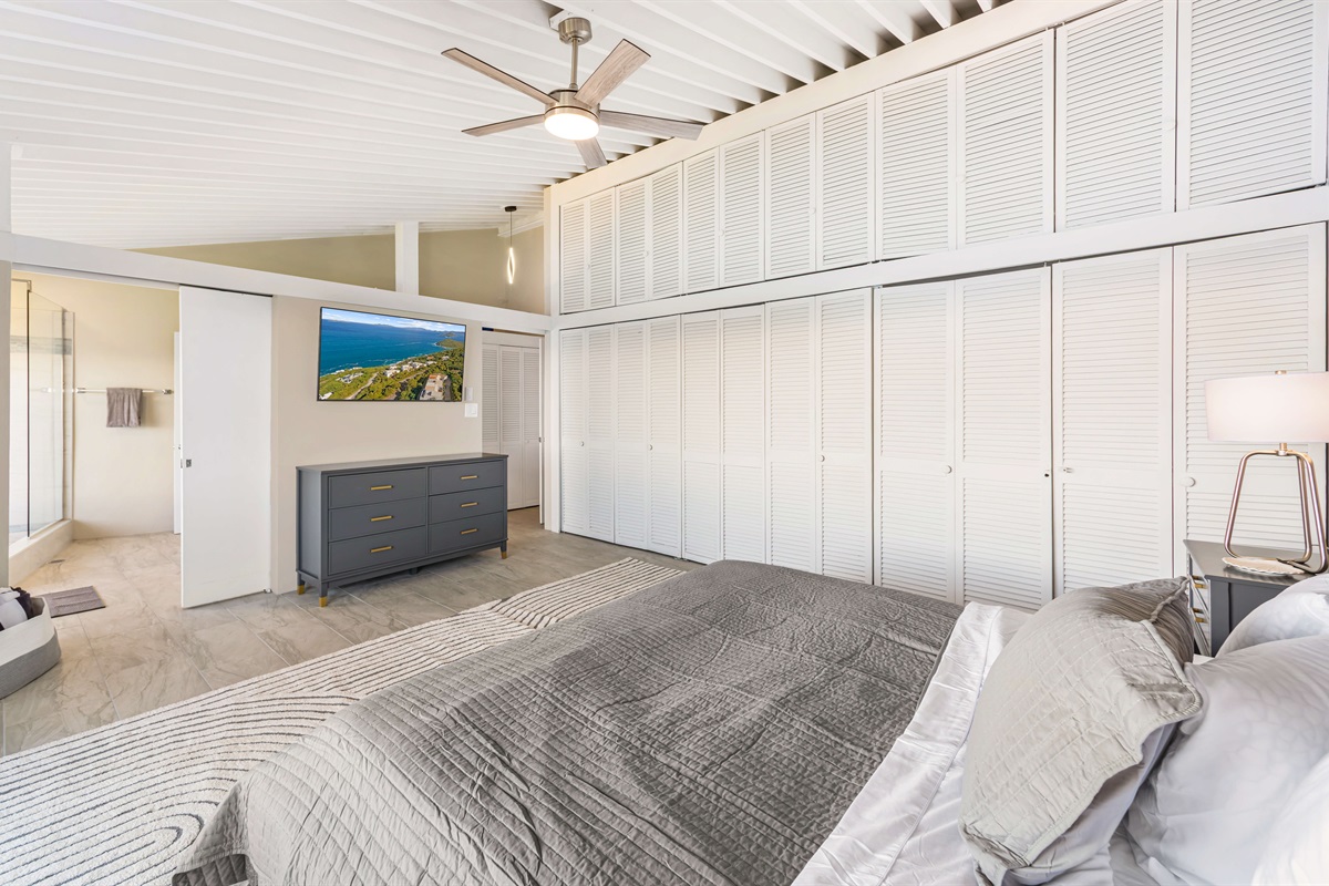 A smart TV, ceiling fan, ensuite bathroom round up the primary bedroom