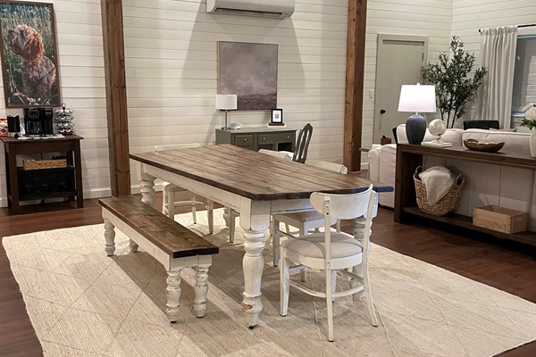 Spacious dining table with seating for everyone. Great for meals, games or morning coffee.