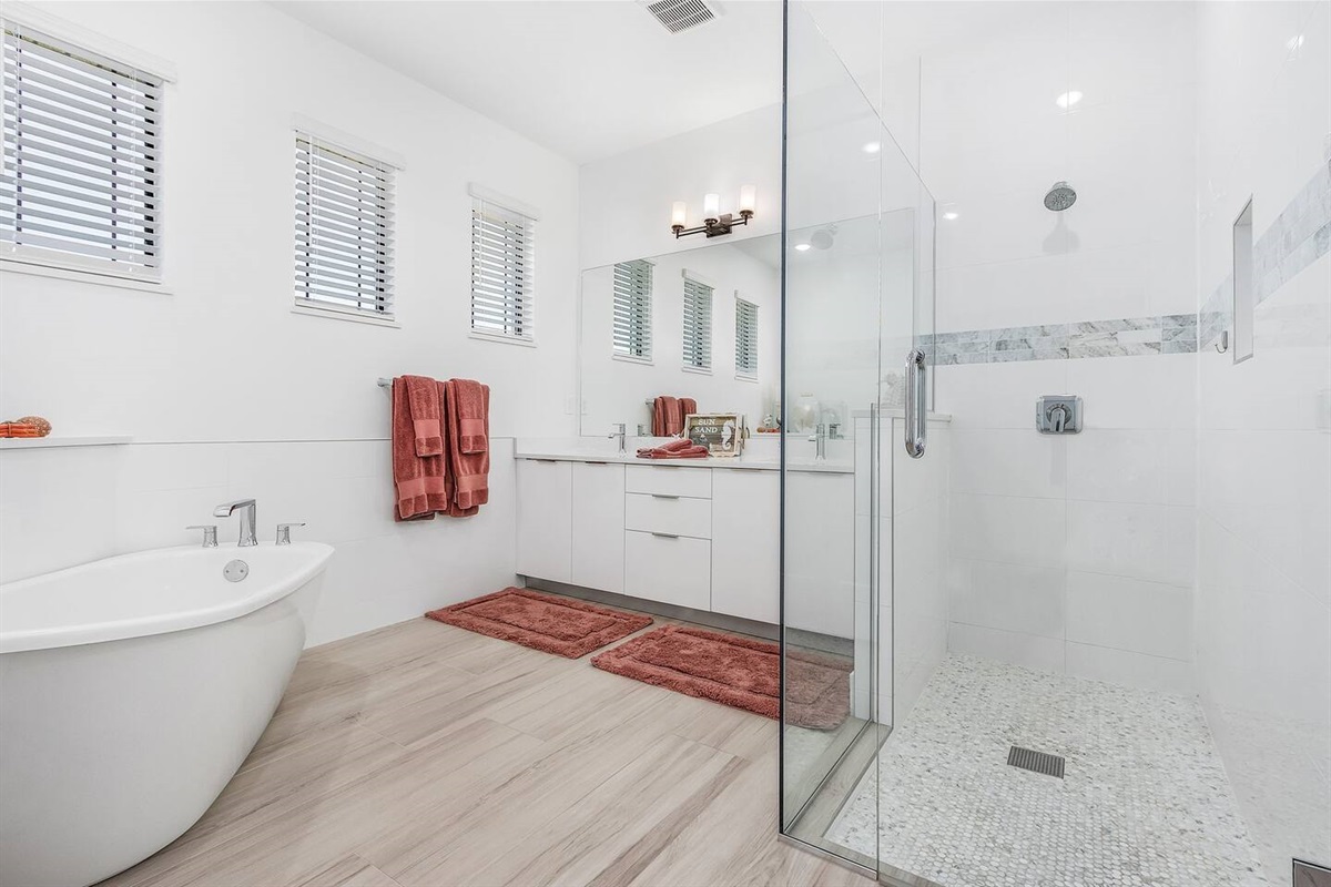 Luxurious primary ensuite bathroom featuring a freestanding tub, walk-in shower, and dual sinks—your perfect sanctuary for relaxation and rejuvenation.