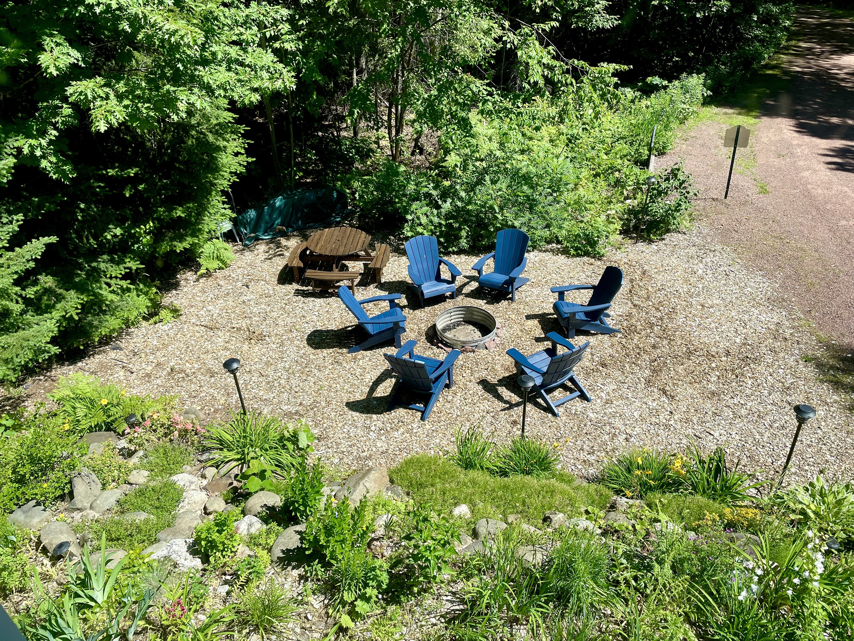 View or rock garden from upstairs bathroom two large windows to take in the perennial garden and wooded views, blinds for privacy. 