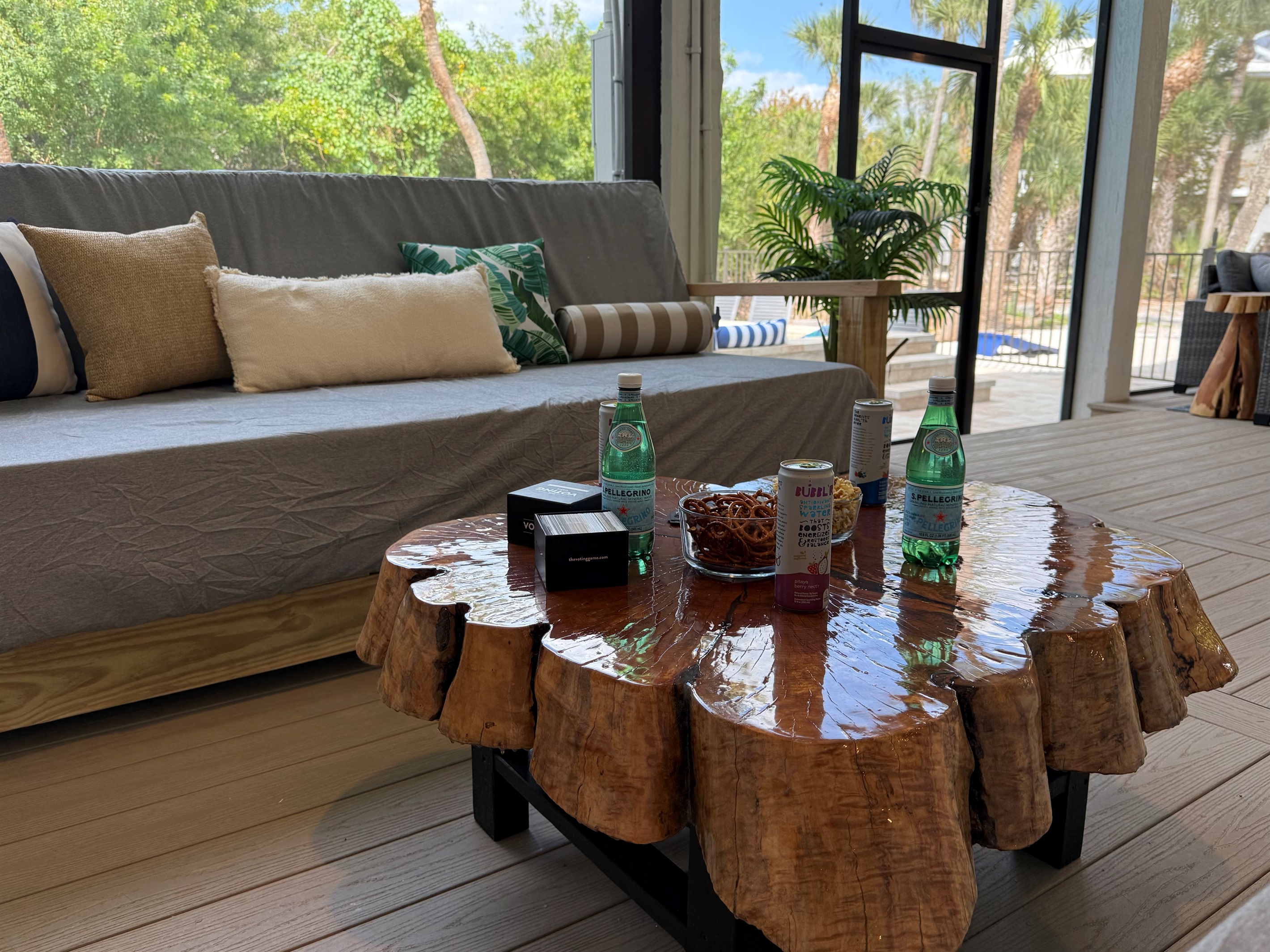 The screened-in lower level features two daybeds-perfect for an afternoon siesta or games
