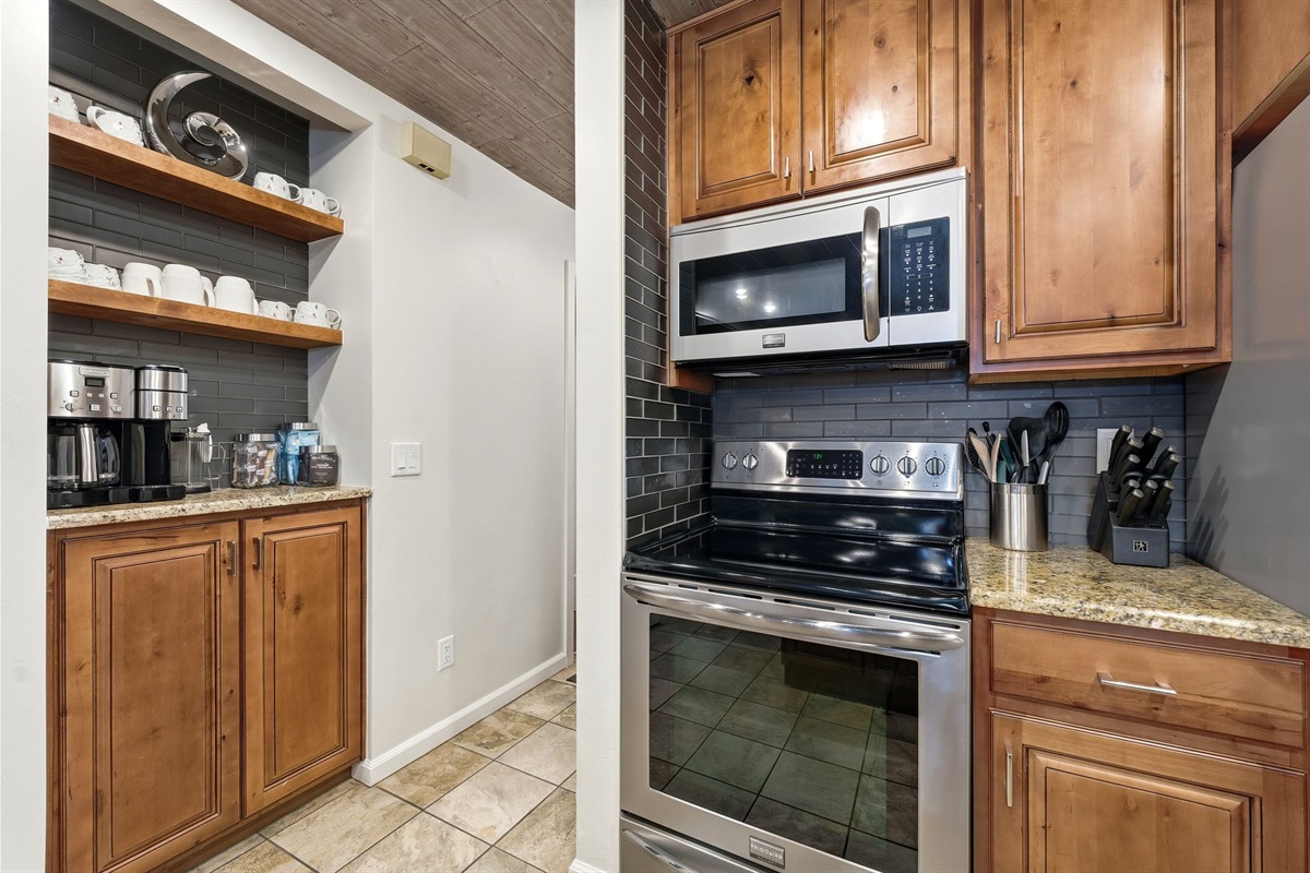 Kitchen, entryway, and coffee bar all meet here.