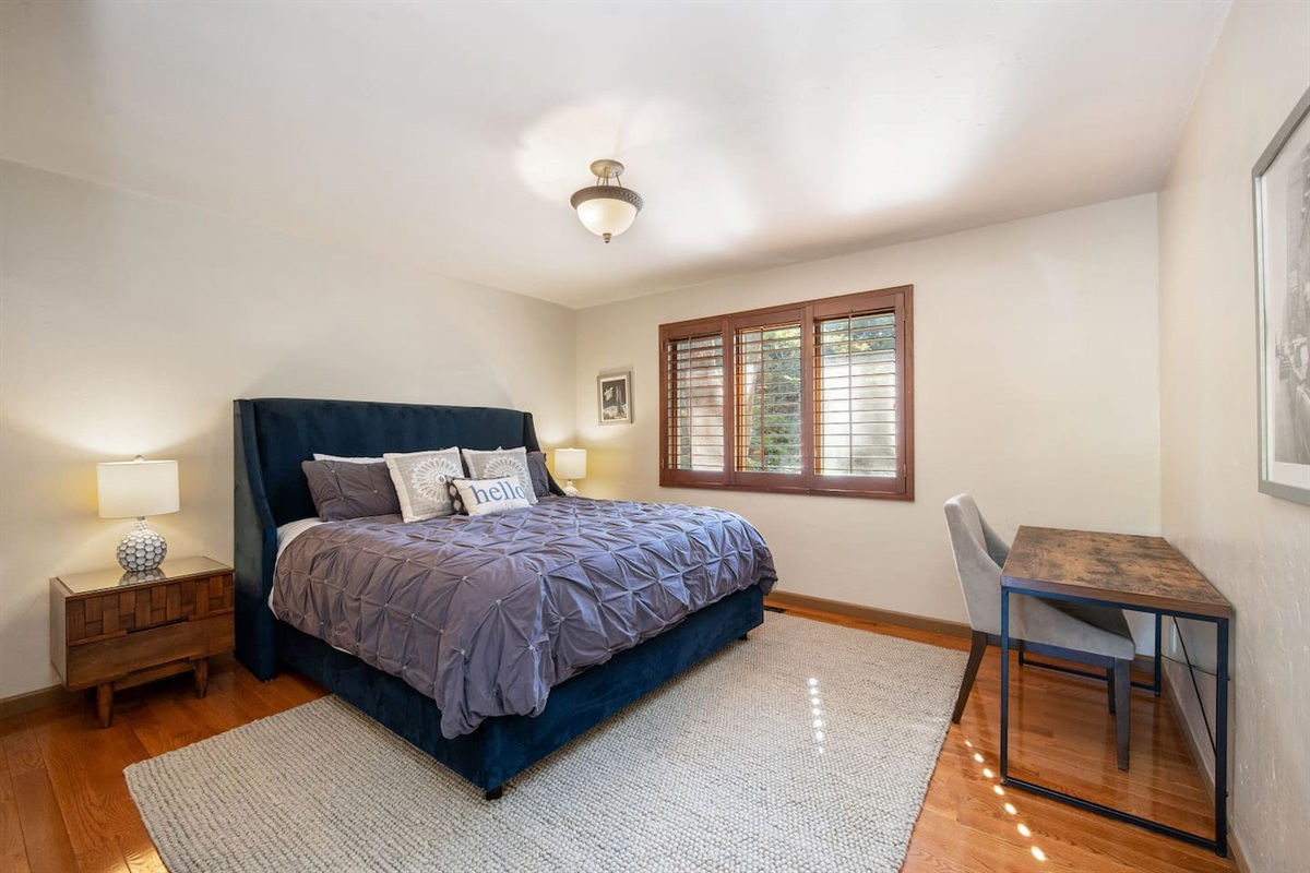 Guest Bedroom with King bed and desk.