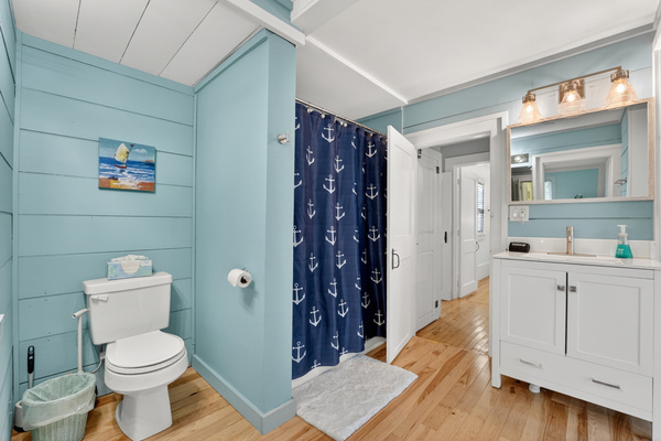 Full bathroom with a shower and vanity, offering plenty of space to get ready for the day.
