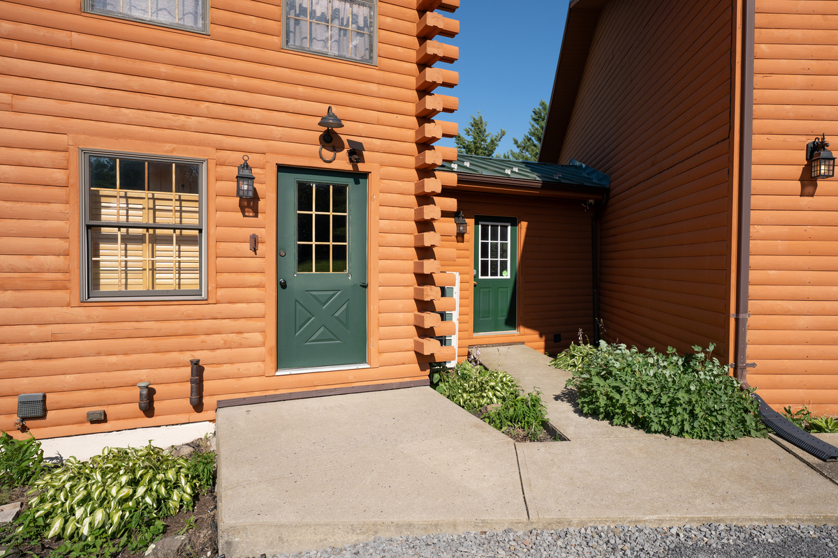 Walkway leading to the green door