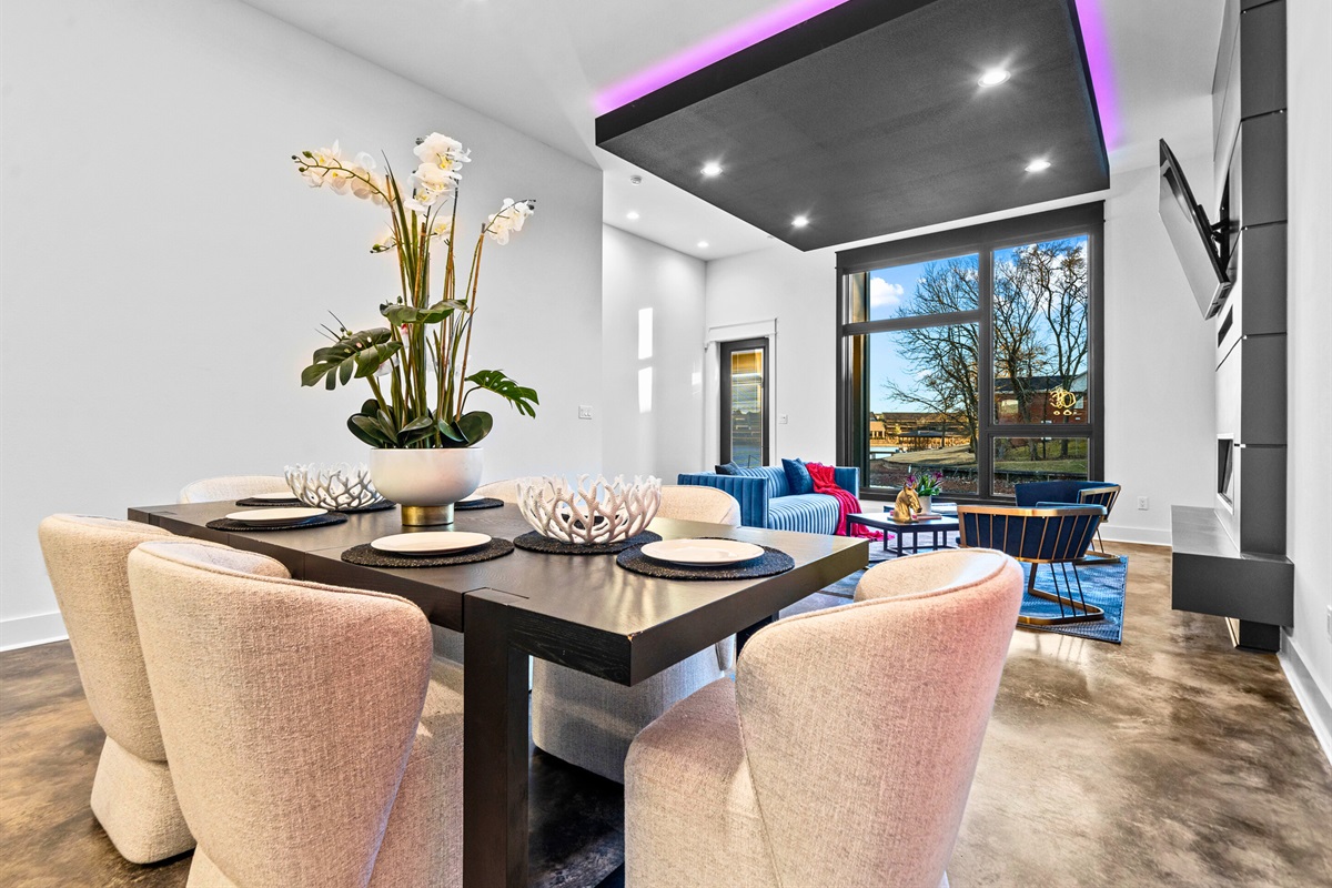 The dining area flows seamlessly into the kitchen, with its contemporary design and bright, open layout, perfect for entertaining.