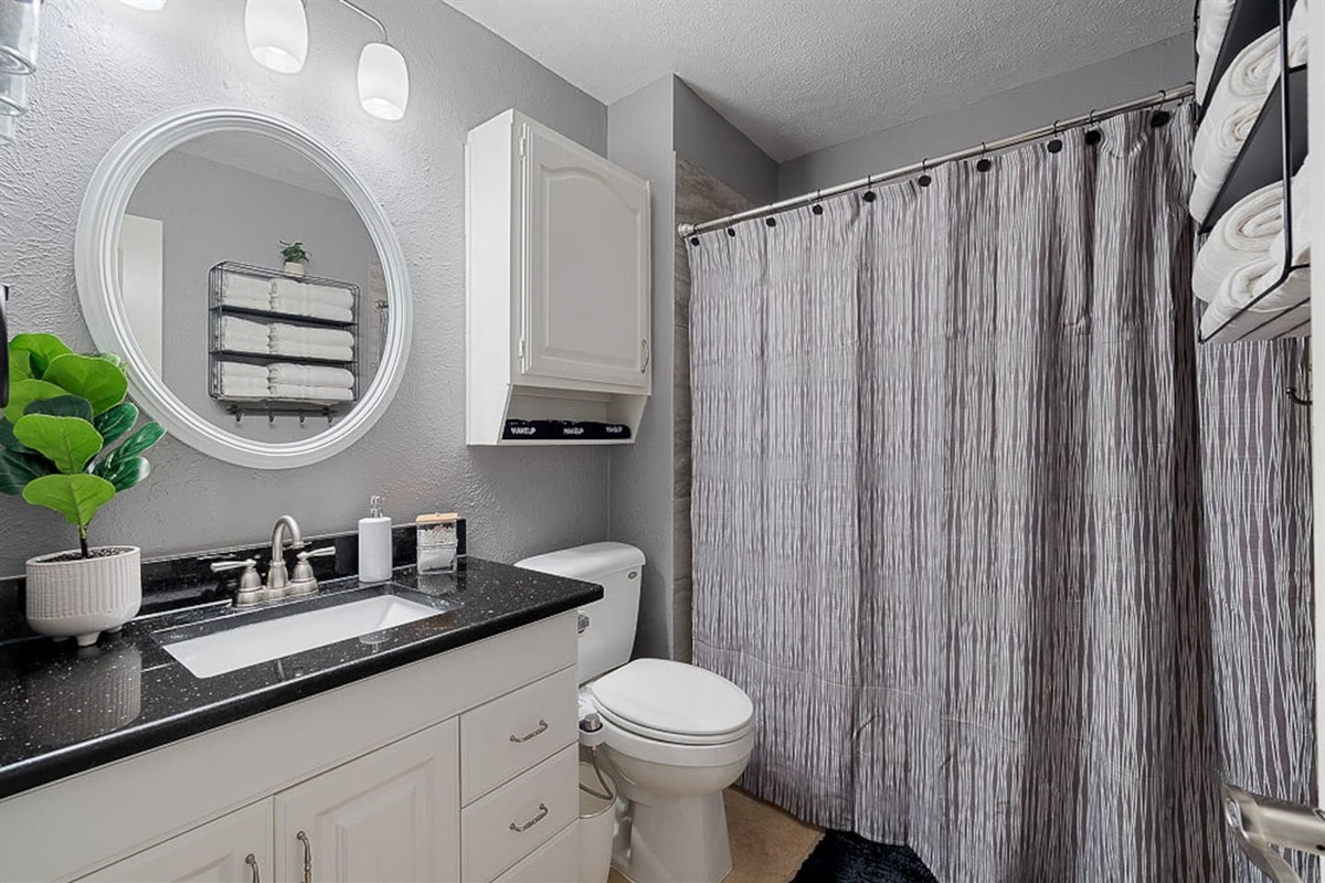 Enjoy this full bathroom with a shower and bathtub, fully equipped with fresh towels, makeup cloths, shower gel, and Terra Pure shampoo and conditioner for your relaxation