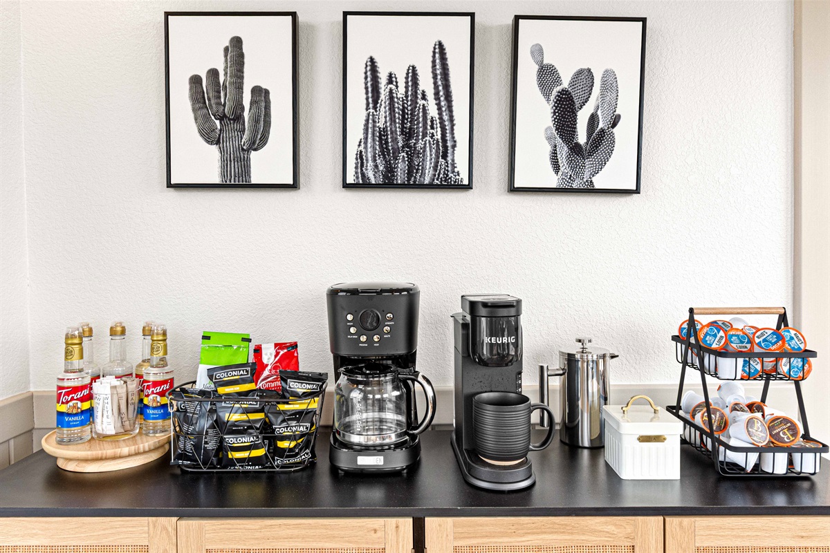 Coffee bar! Fully Loaded! Stocked with k-cups, drip coffee, tea, sugar, and flavored syrups. Make fresh coffee every morning with the Keurig duo, coffee press, or iced coffee maker
