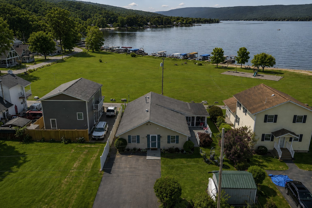 Charming lakeside retreat with ample green space and easy access to Honeoye Lake. Ideal for family gatherings and outdoor fun. 