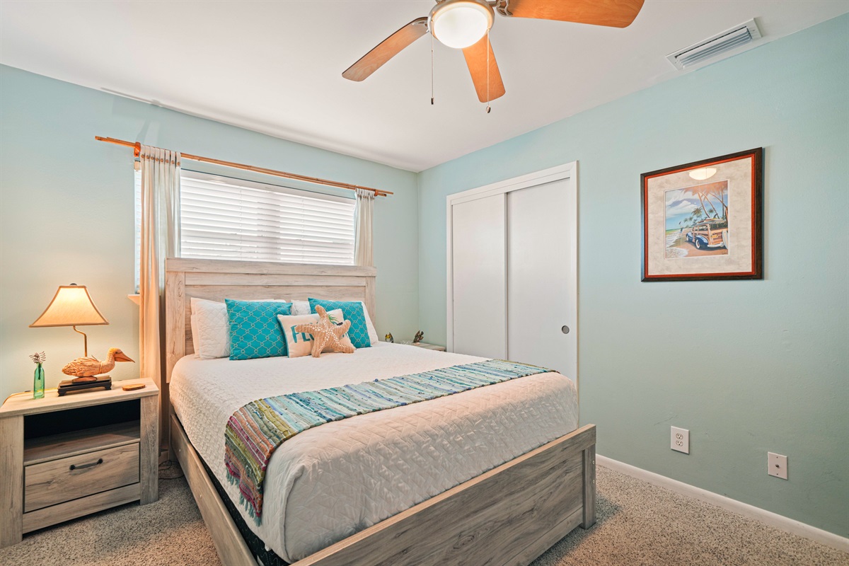 The guest room feels like its own little coastal escape. Queen bed, driftwood furniture, and teal accents. The Gathering Place sleeps 6.