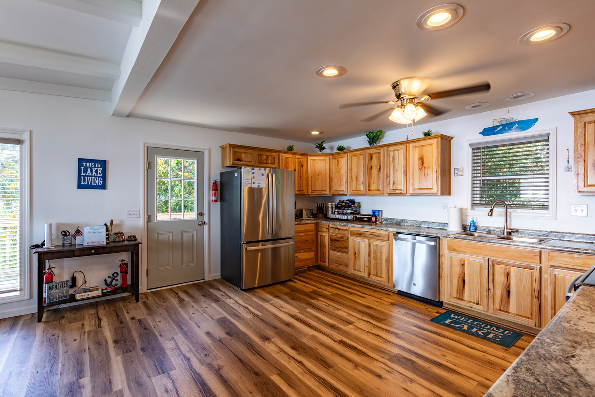 The fully equipped kitchen offers full-size appliances, generous counter space, and room to cook for a crowd.