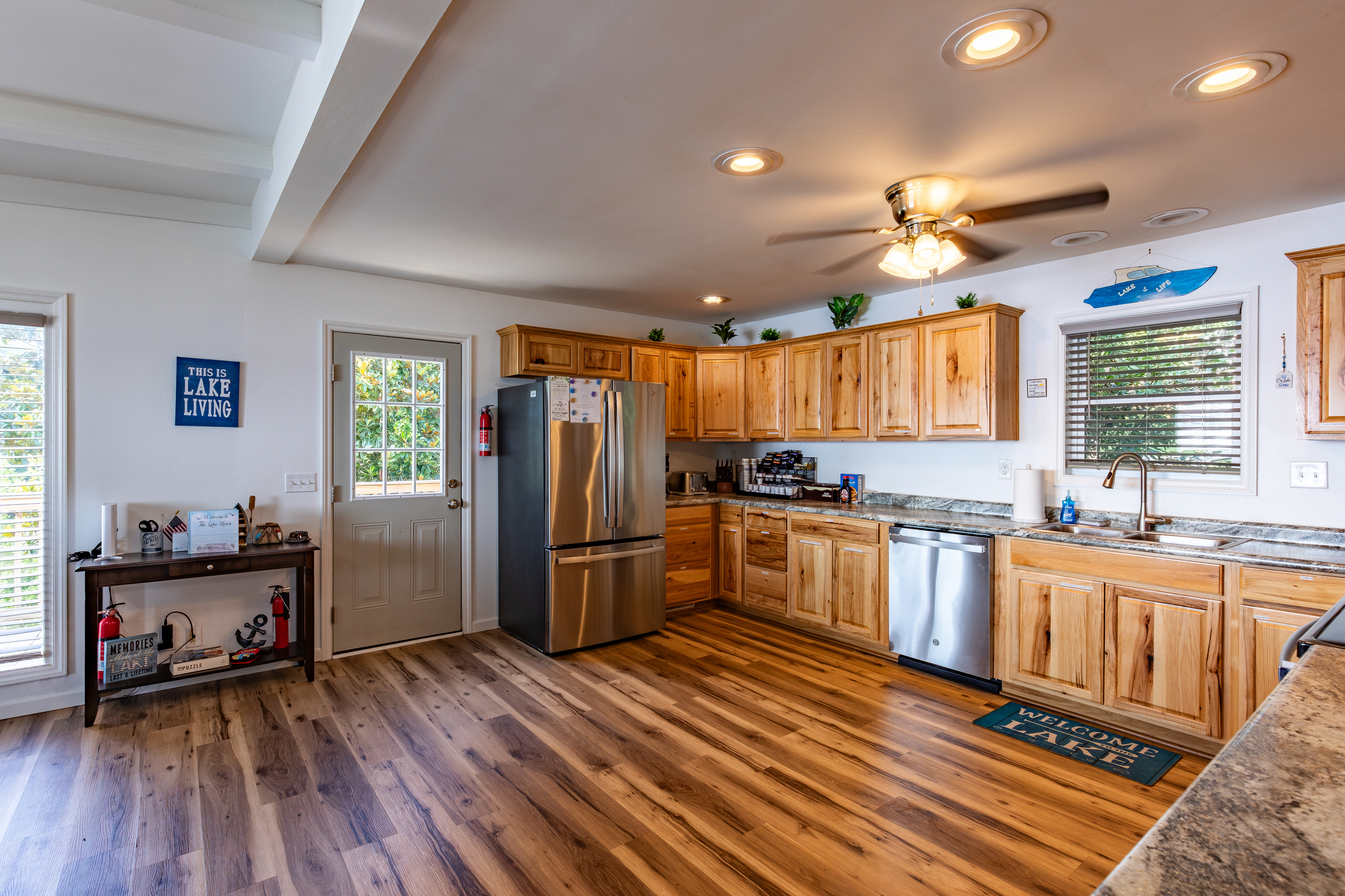 The fully equipped kitchen offers full-size appliances, generous counter space, and room to cook for a crowd.
