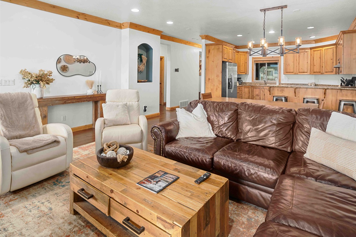 Inviting living space designed for gathering, with seamless flow into the kitchen and dining area.