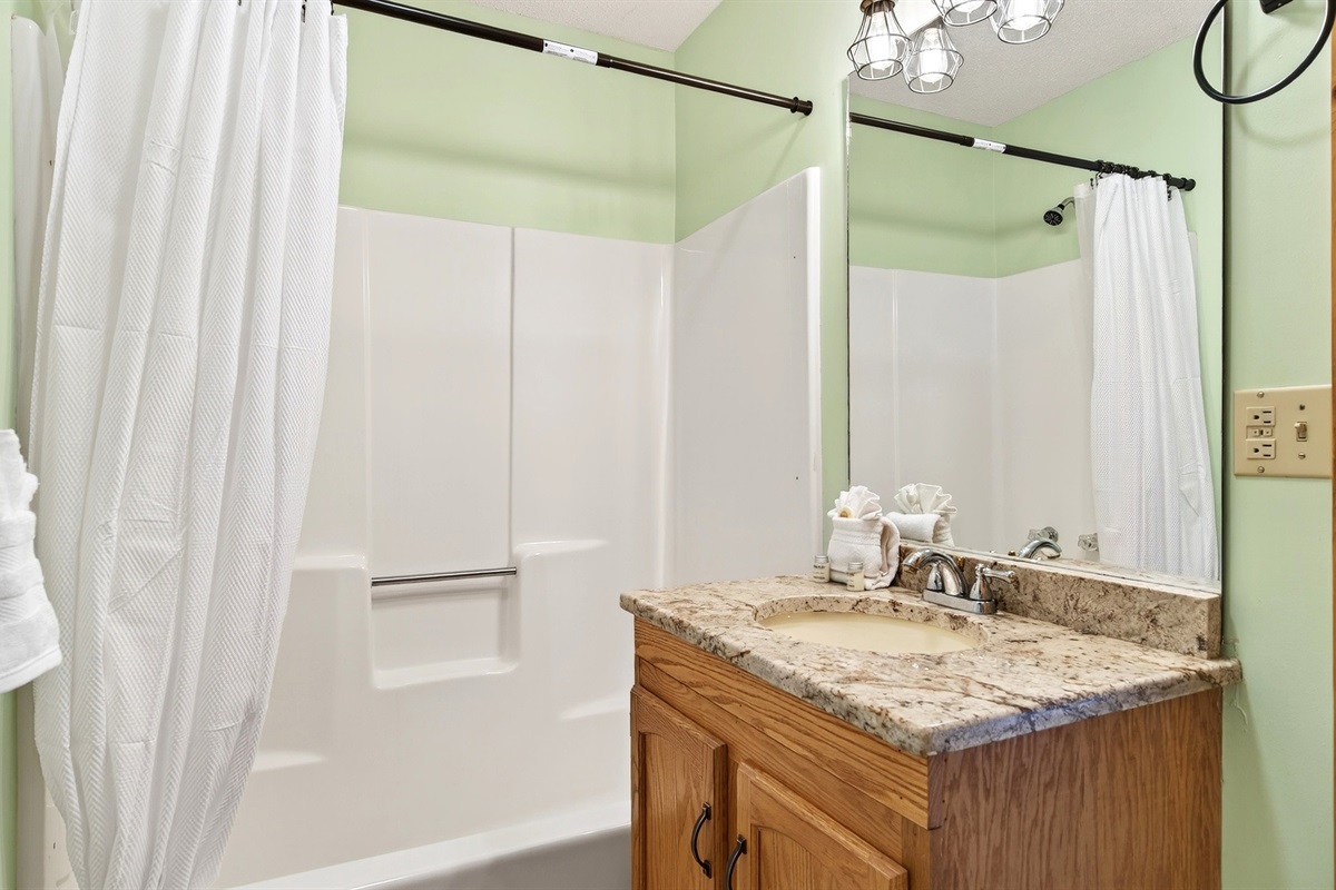 Ensuite bathroom attached to the king bedroom with tub and shower combo
