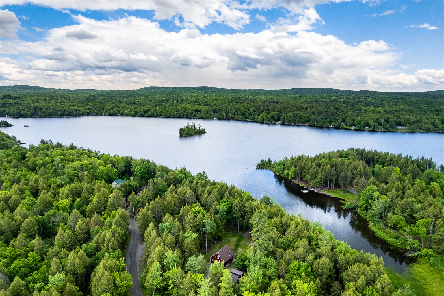 Private lake access with a dock in protected cove, and quiet surroundings on Sebec Lake