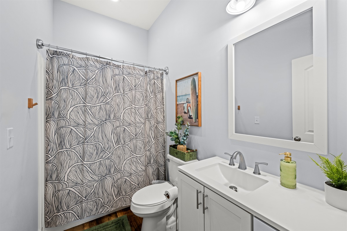 Clean, bright, and ready for relaxing after the beach. A spacious bathroom with everything you need during your Miramar Beach stay.
