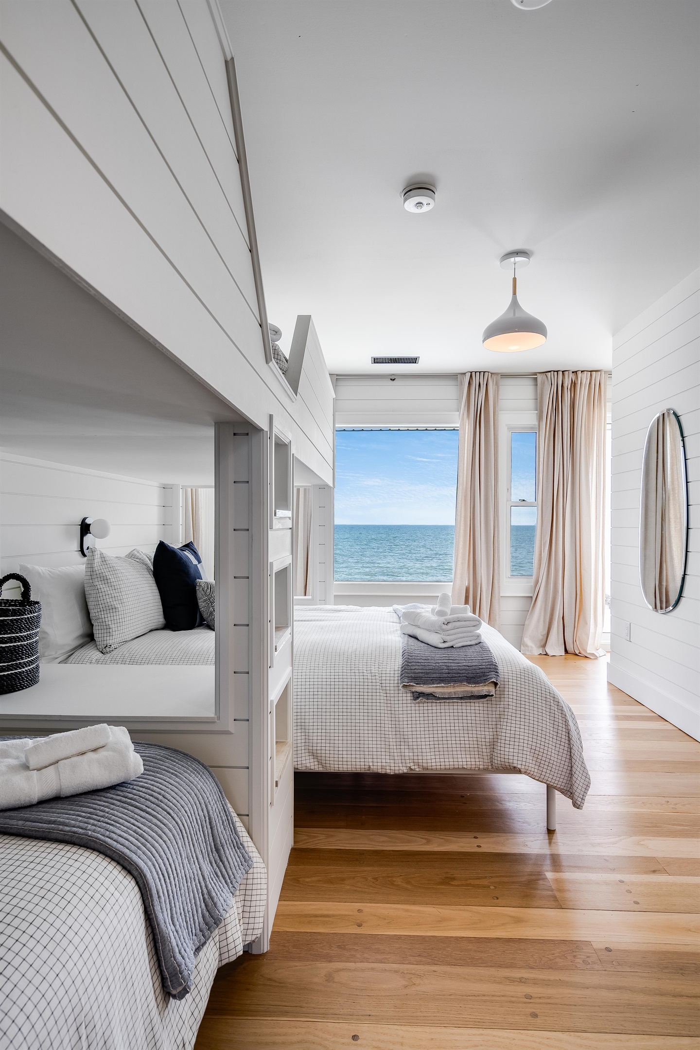 Bedroom with 3 twins, and 1 Queen bed. 