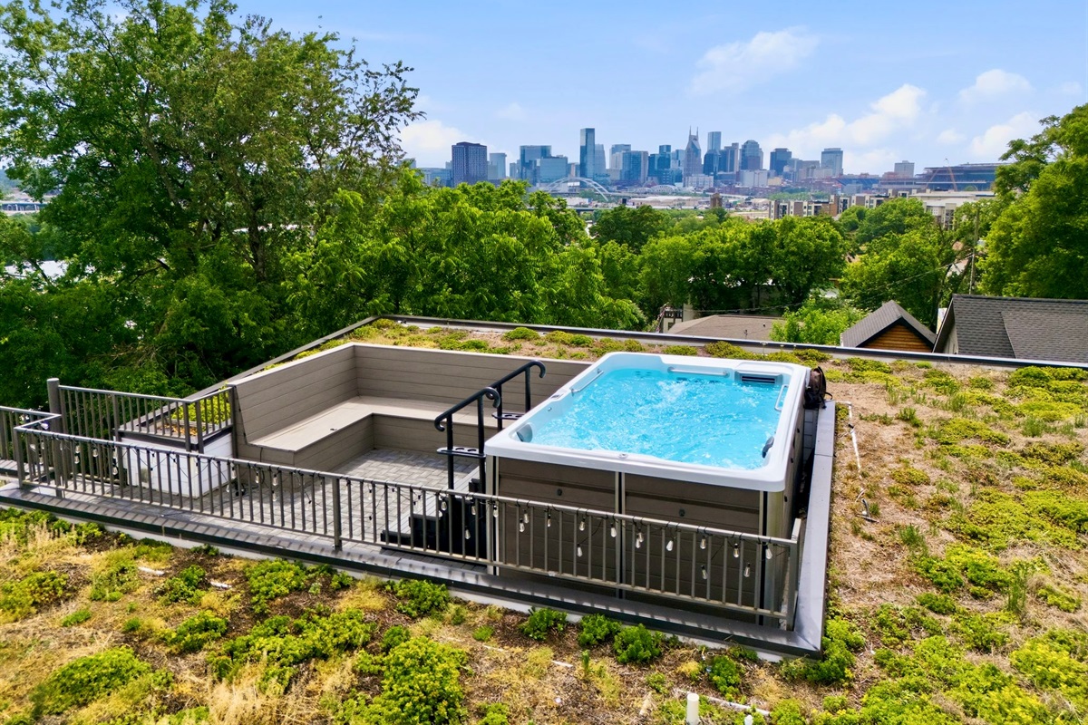 Rooftop pool w/ city skyline backdrop — your own private escape above it all.
