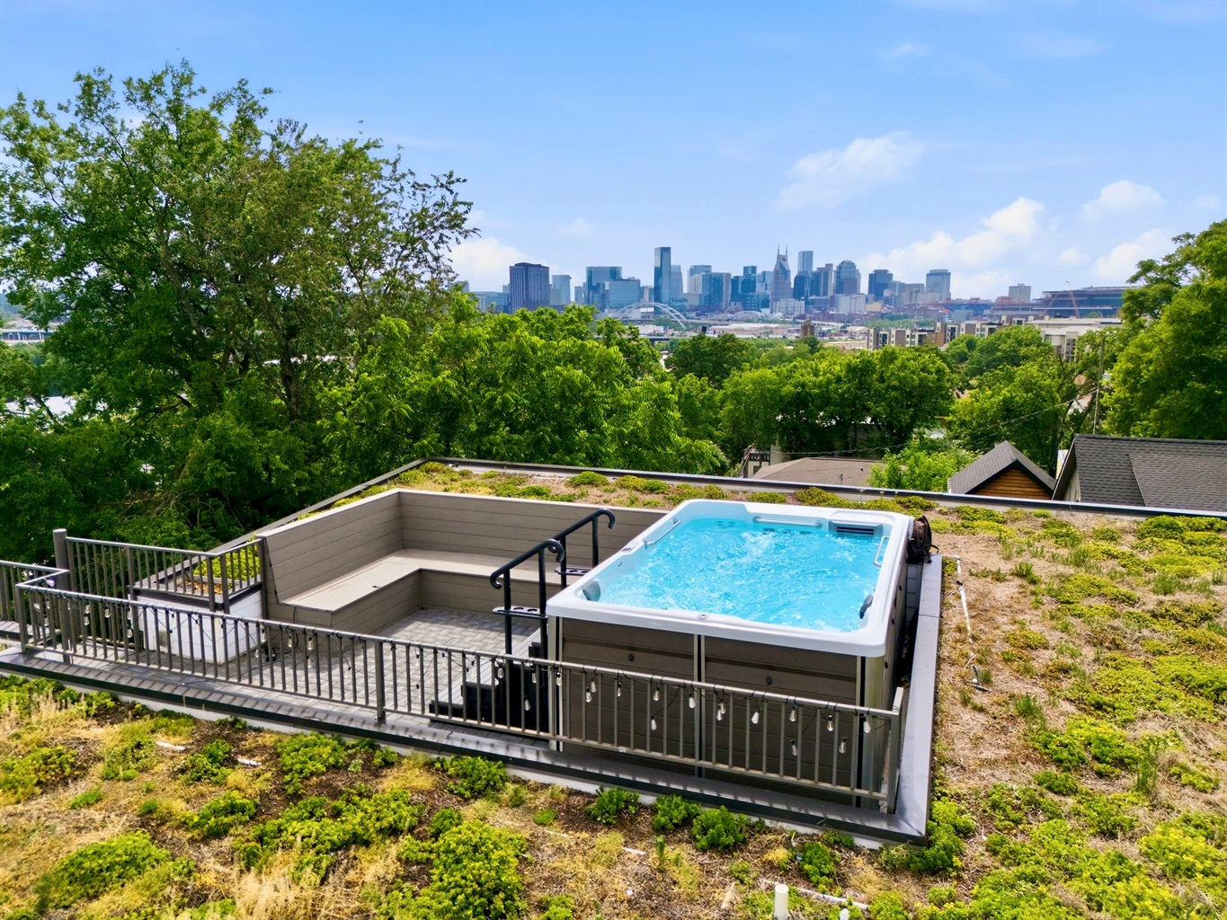 Rooftop pool w/ city skyline backdrop — your own private escape above it all.
