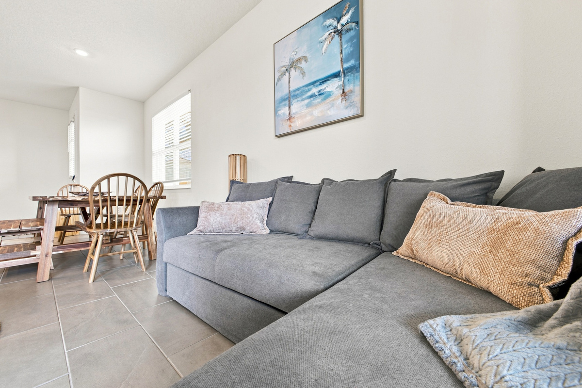 Bottom portion of couch extends up and out to form a sofa bed.  