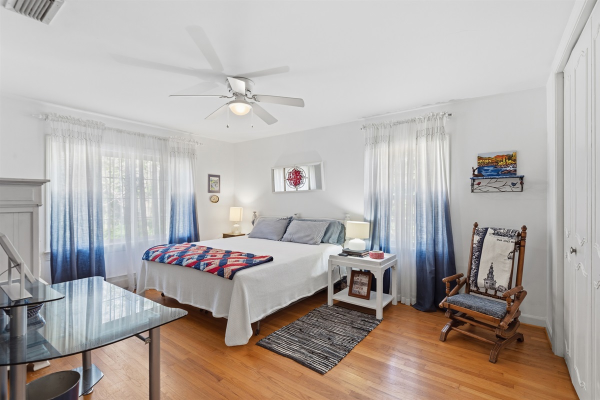 Relaxing bedroom with soft blue accents and a cozy rocking chair