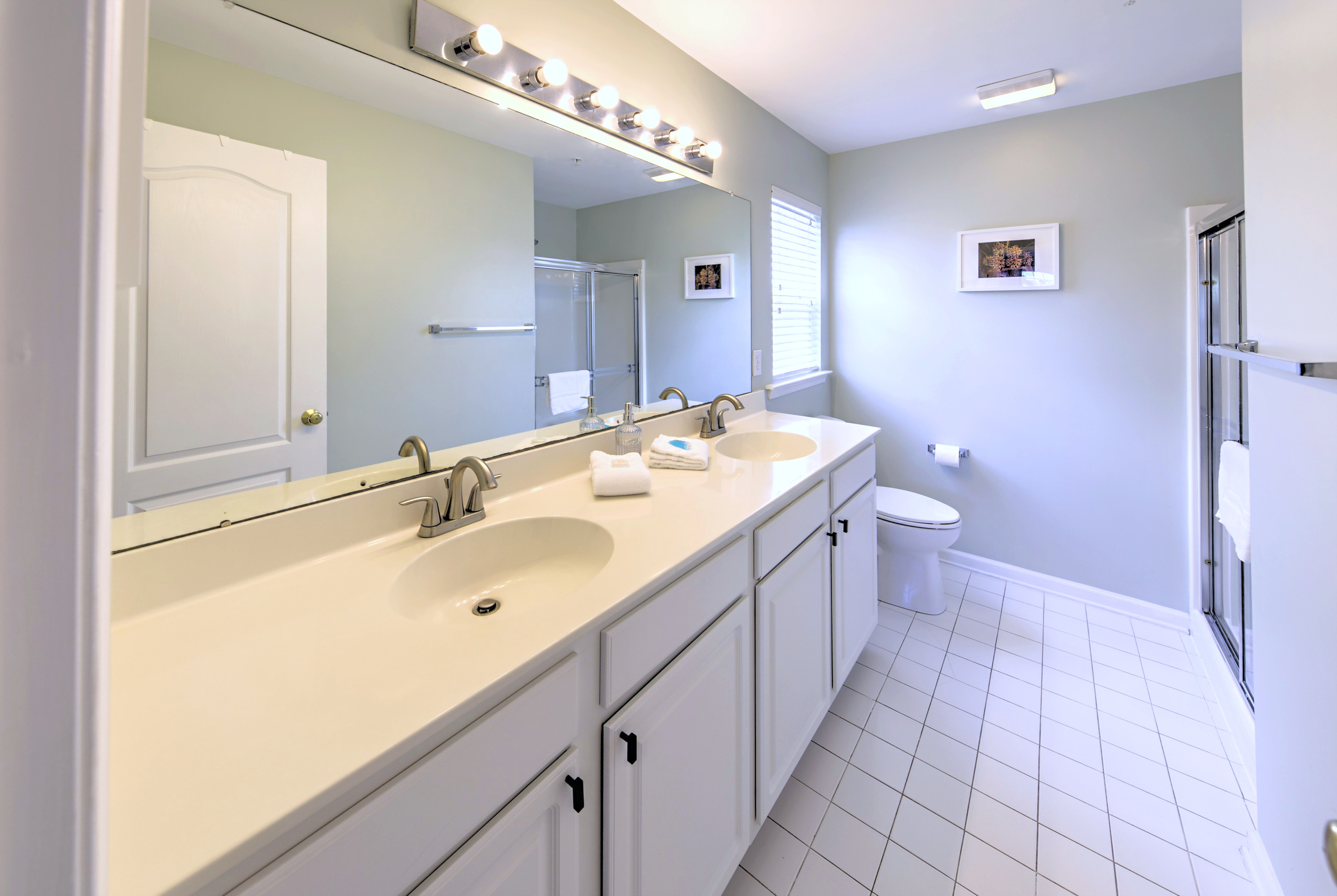 Primary Bathroom with dual sinks to make getting ready a breeze.