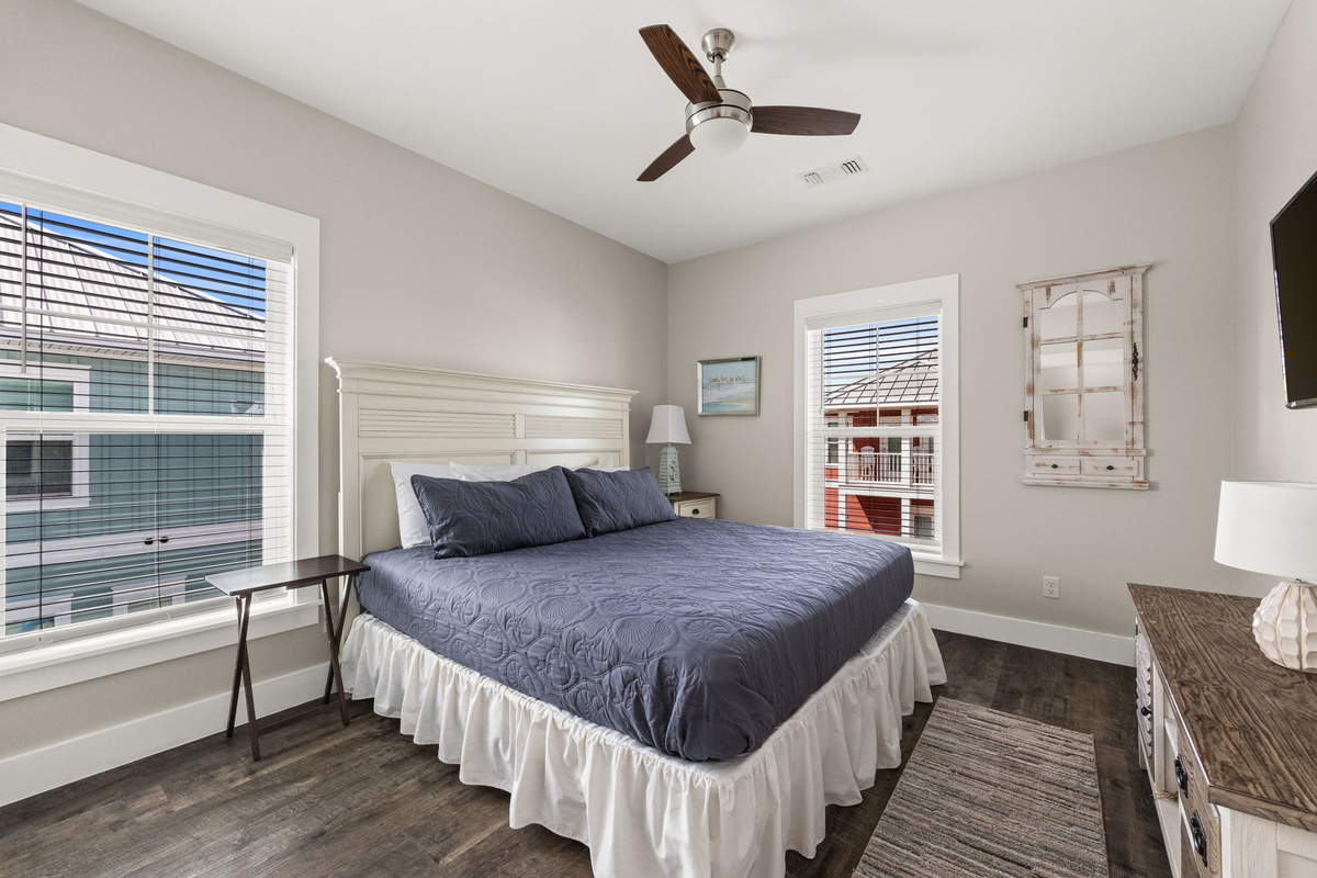 Additional second floor & 4th king guest bedroom with a smart TV and peaceful pool views