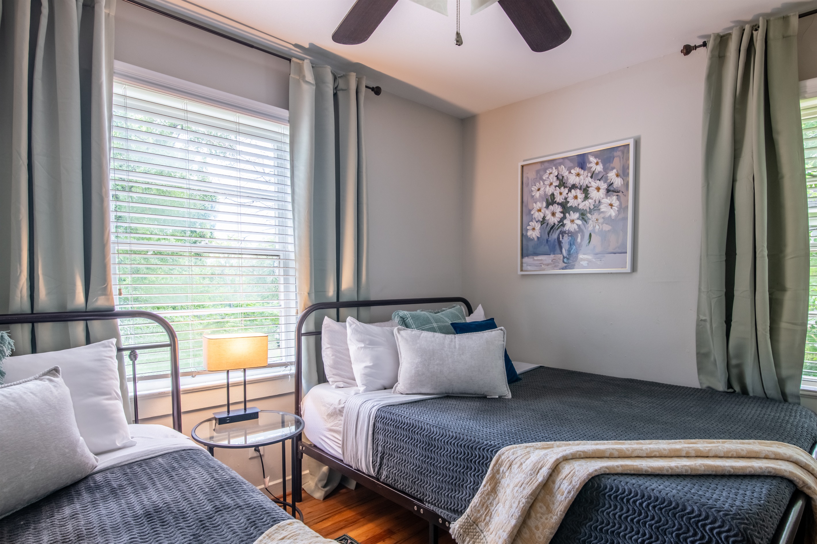 Another view of the twin bedroom, showcasing thoughtful decor and a peaceful setup.