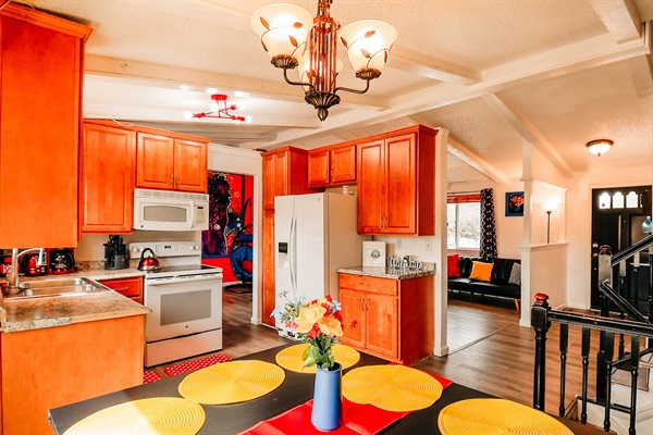 A seamless blend of a well-equipped kitchen and a welcoming dining area, where delicious meals are prepared and shared.
