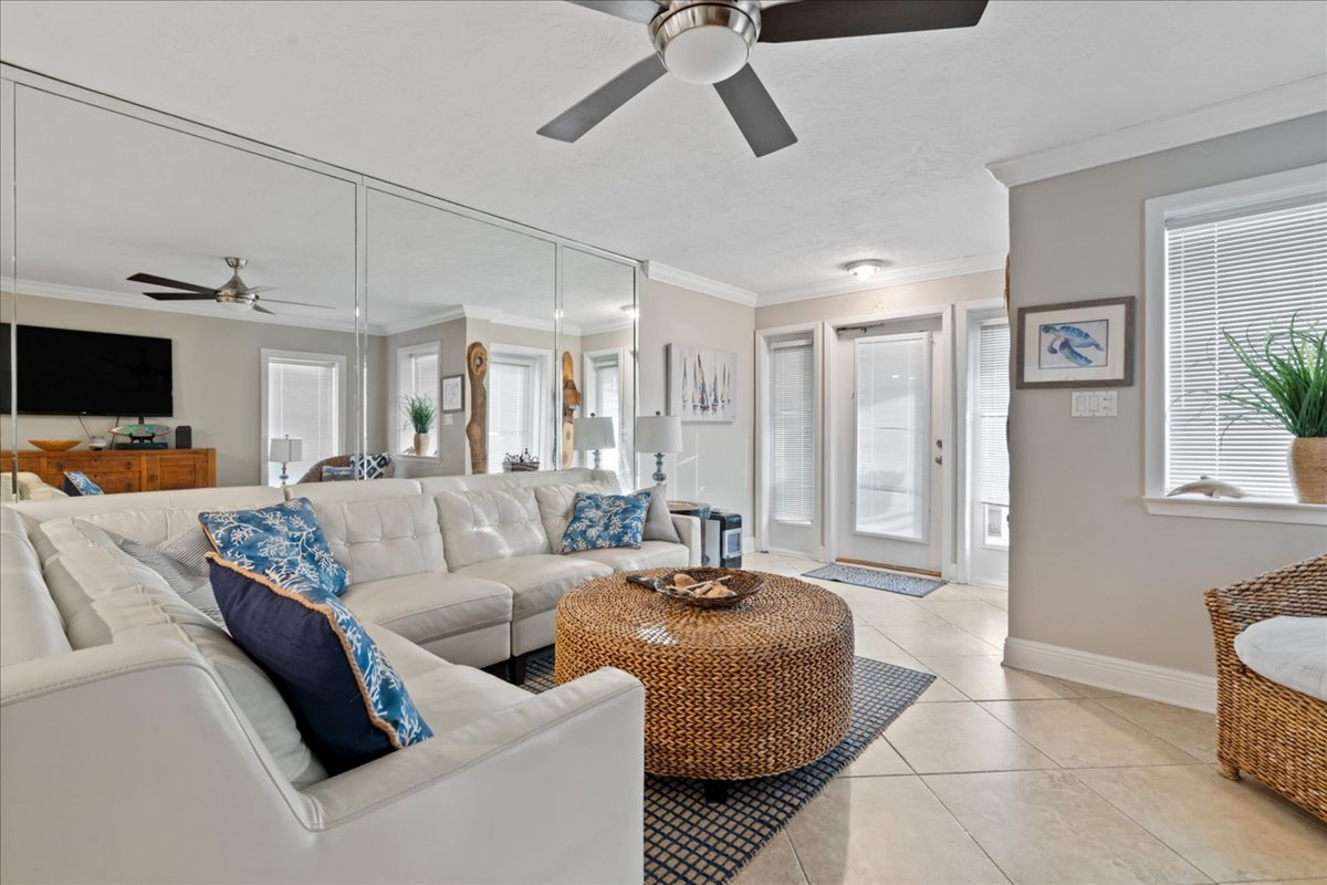 2nd Floor has the Primary Living Space with a comfortable, Gulf View living room with tons of seating around a 55" Smart TV!