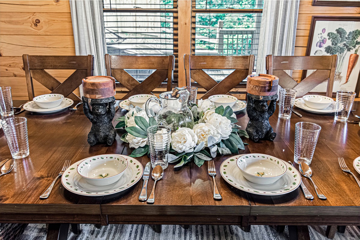 Dining Room: Gather around this charming table, featuring playful bear decor and lush floral accents!
