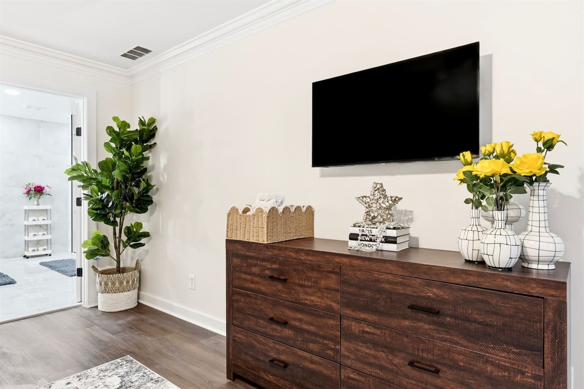 Beautiful second-level master bedroom featuring a king bed, a Roku-powered Smart TV, located all the way to the right at the top of the staircase. This room includes 2 full-body towels, 2 washcloths, and 2 hand towels for your stay.