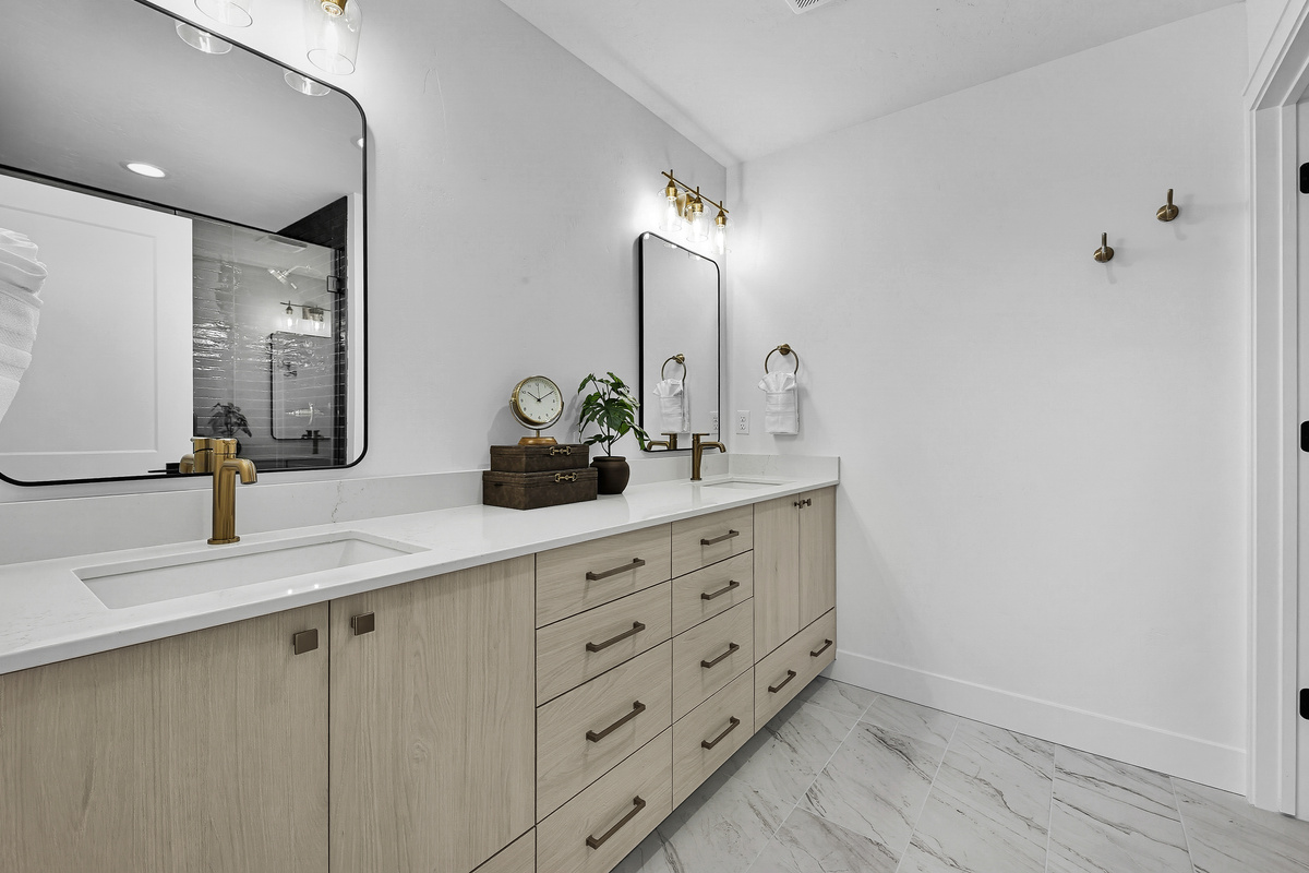 3rd floor bedroom with king size bed ensuite bathroom with shower and dual sink vanity