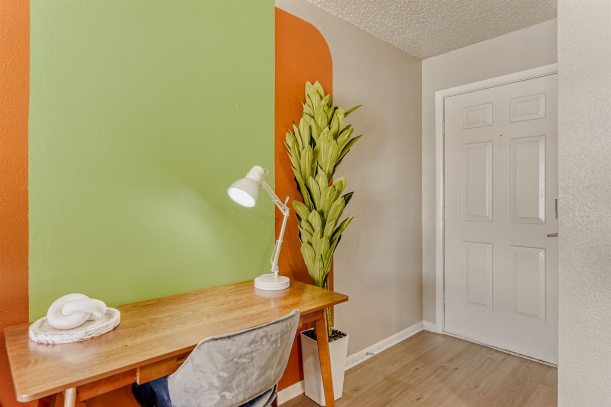 Colorful workspace with bold accents and a cozy, modern vibe.