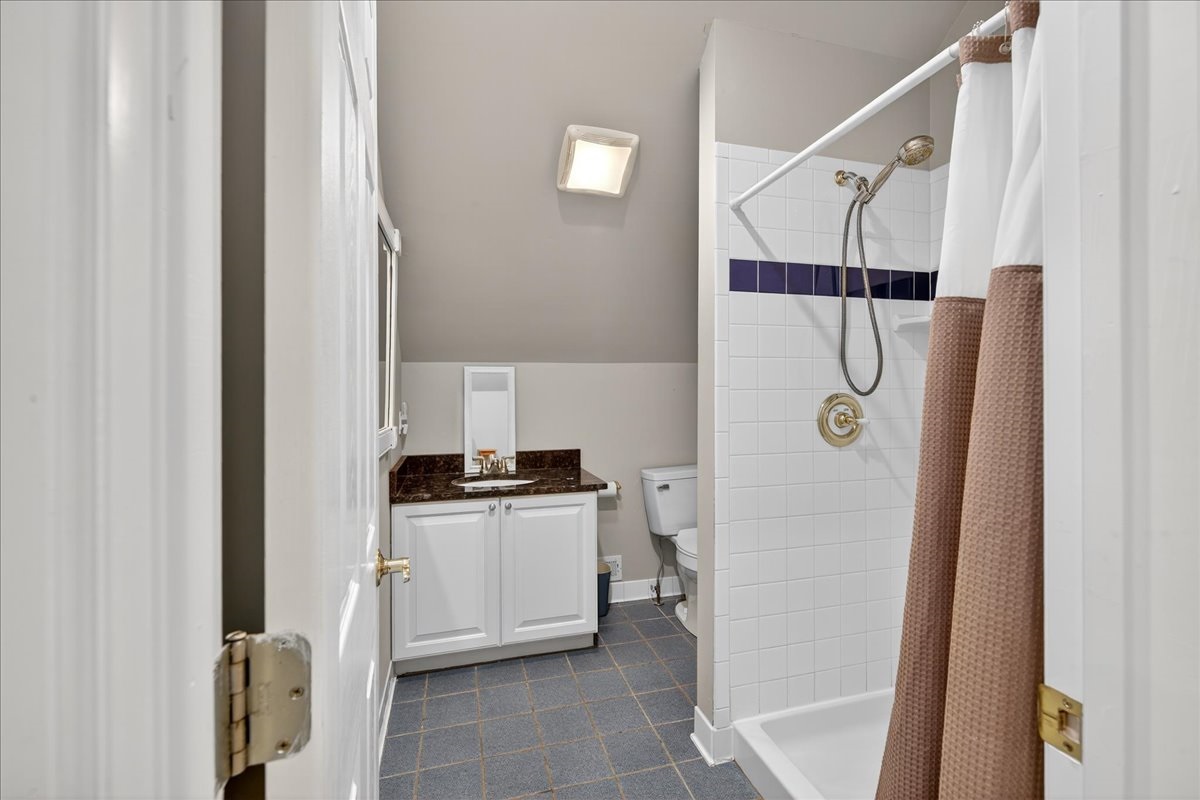 Convenient full bath with walk-in shower.