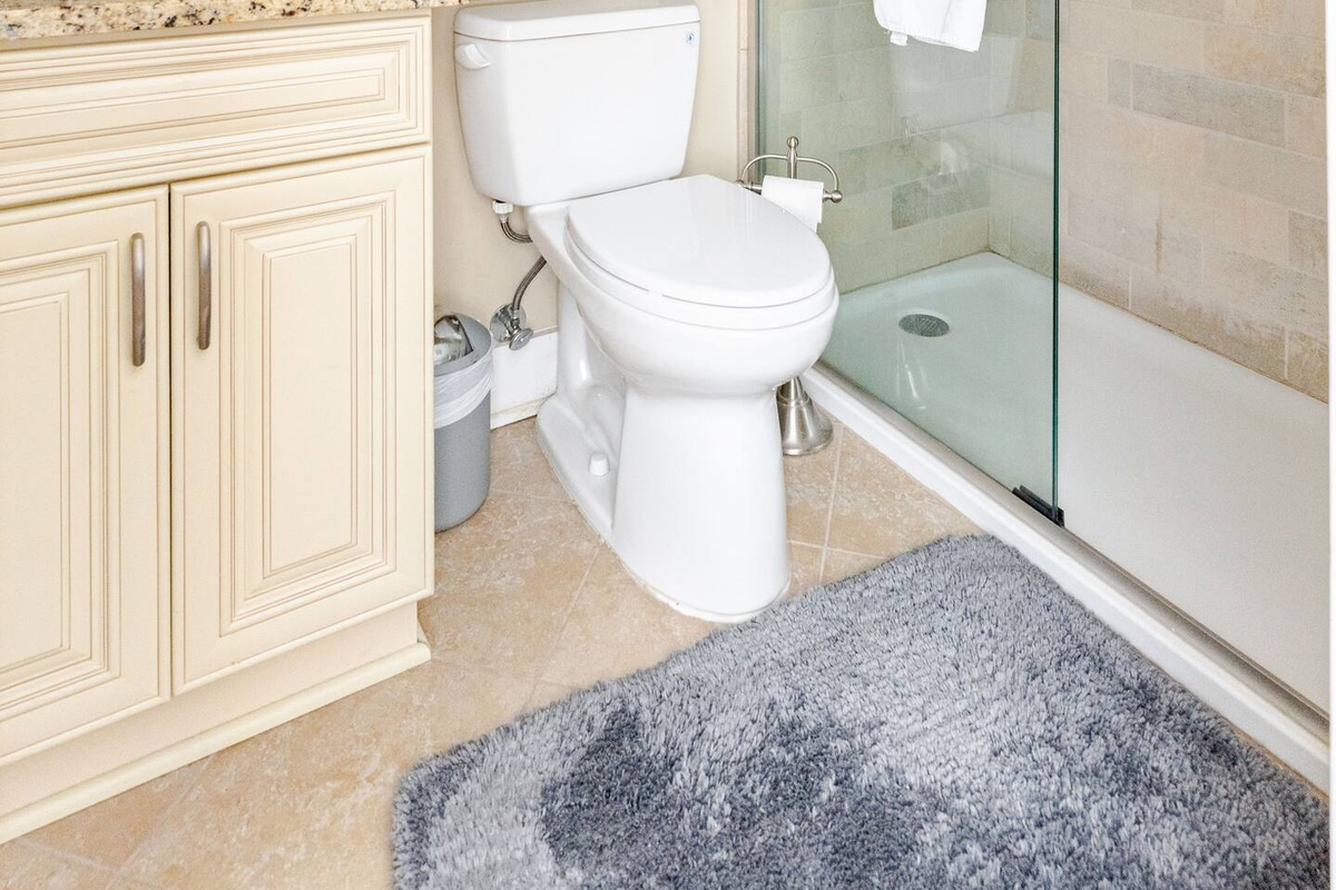 A spacious, beautifully appointed master bathroom designed for comfort and relaxation.