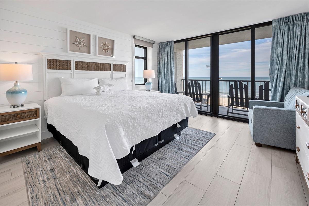 Beautifully designed master bedroom with ocean front view and balcony access